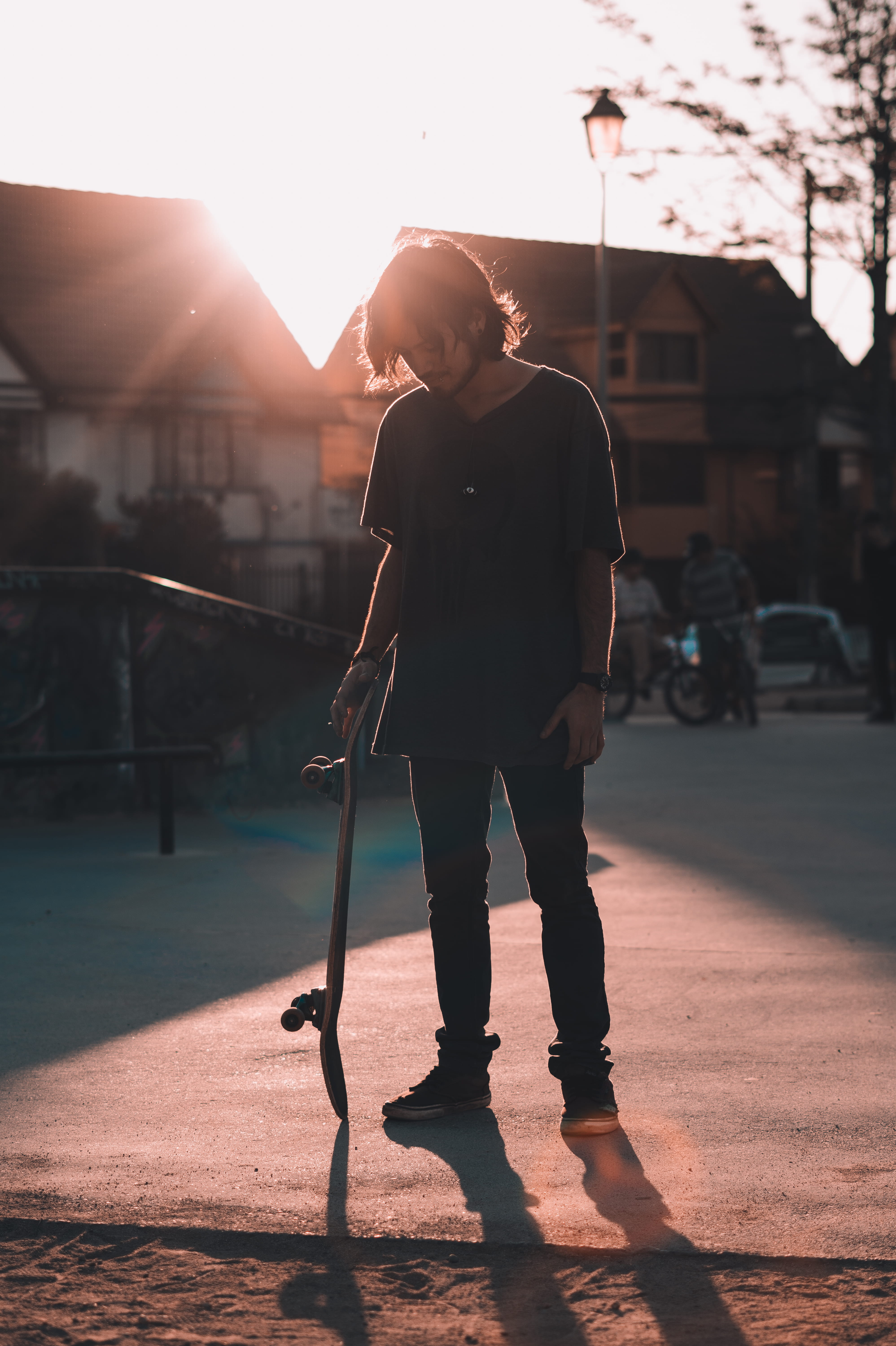 casual clothing, sunlight, skateboarding, city, leisure activity, one person, skate, outdoors, 5K, real people, architecture, man, lens flare, sky, street, Phone HD Wallpaper