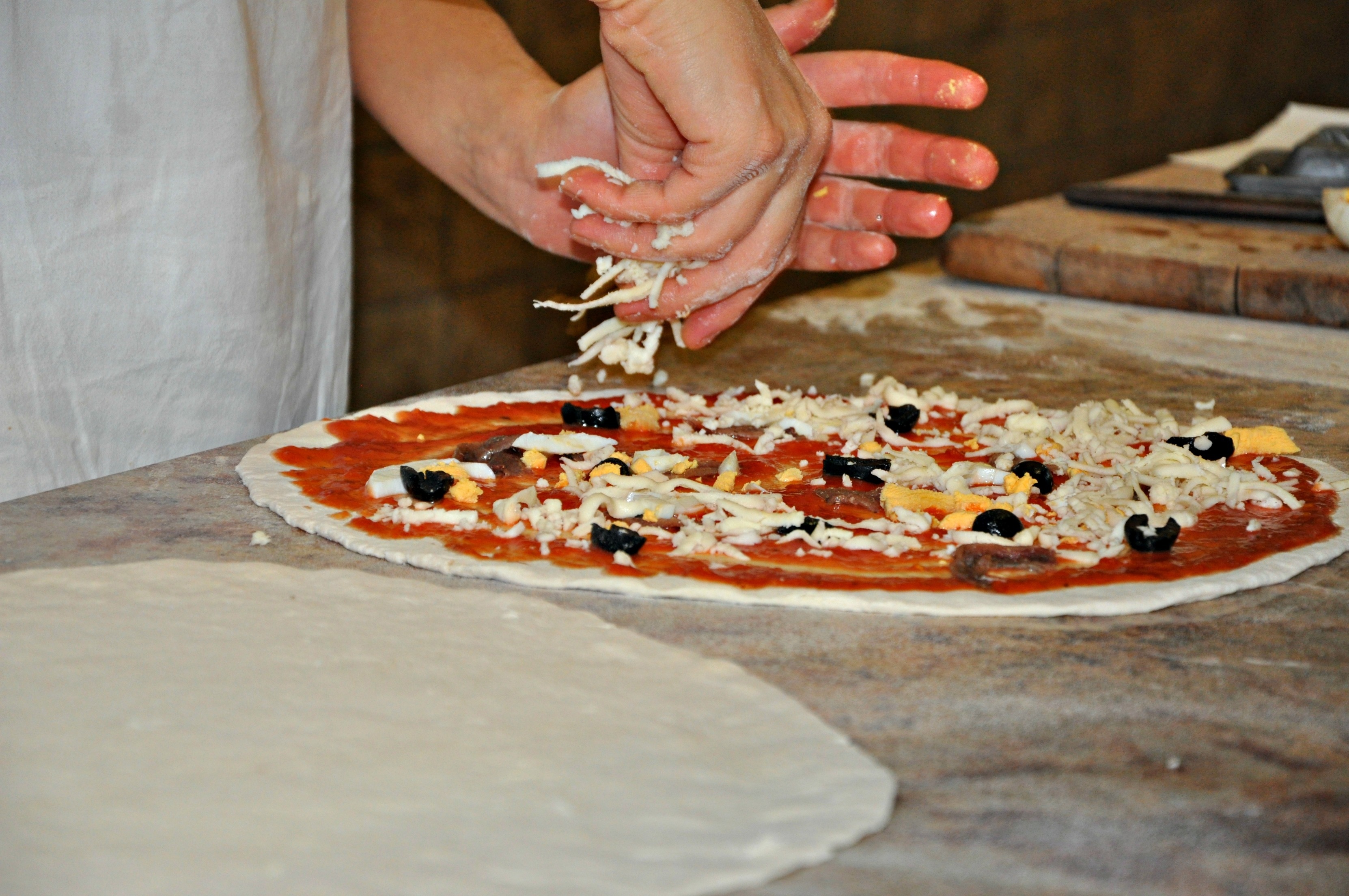 pizza, wood fired oven, table, hand, indoors, human hand, men, one person, 2K, human body part, food and drink, mozzarella, preparation, preparing food, HD Wallpaper
