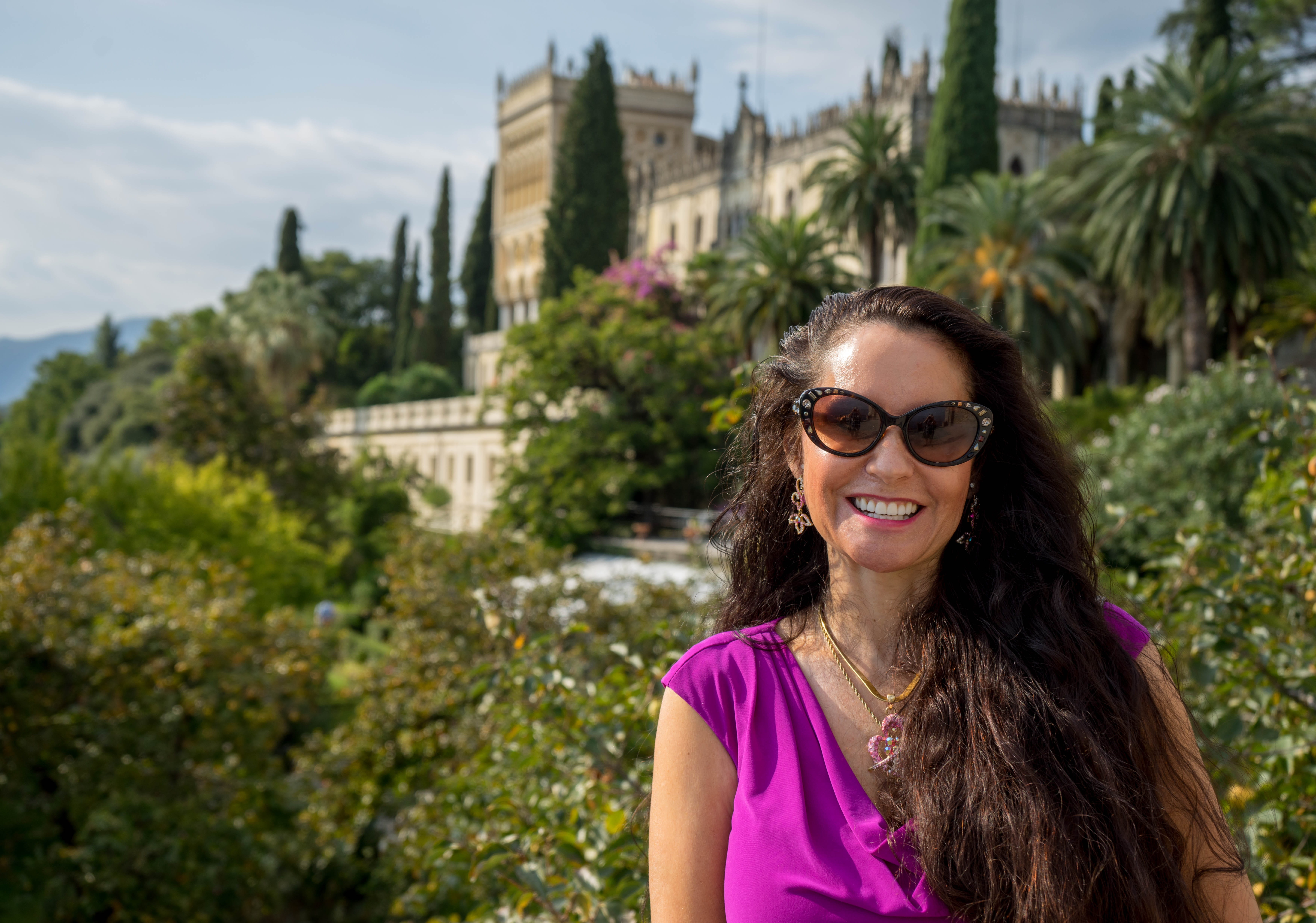 5K, happy, glasses, portrait, cheerful, young adult, isola del garda, women, castle, front view, smiling, fashion, hairstyle, smiling woman, built structure, HD Wallpaper