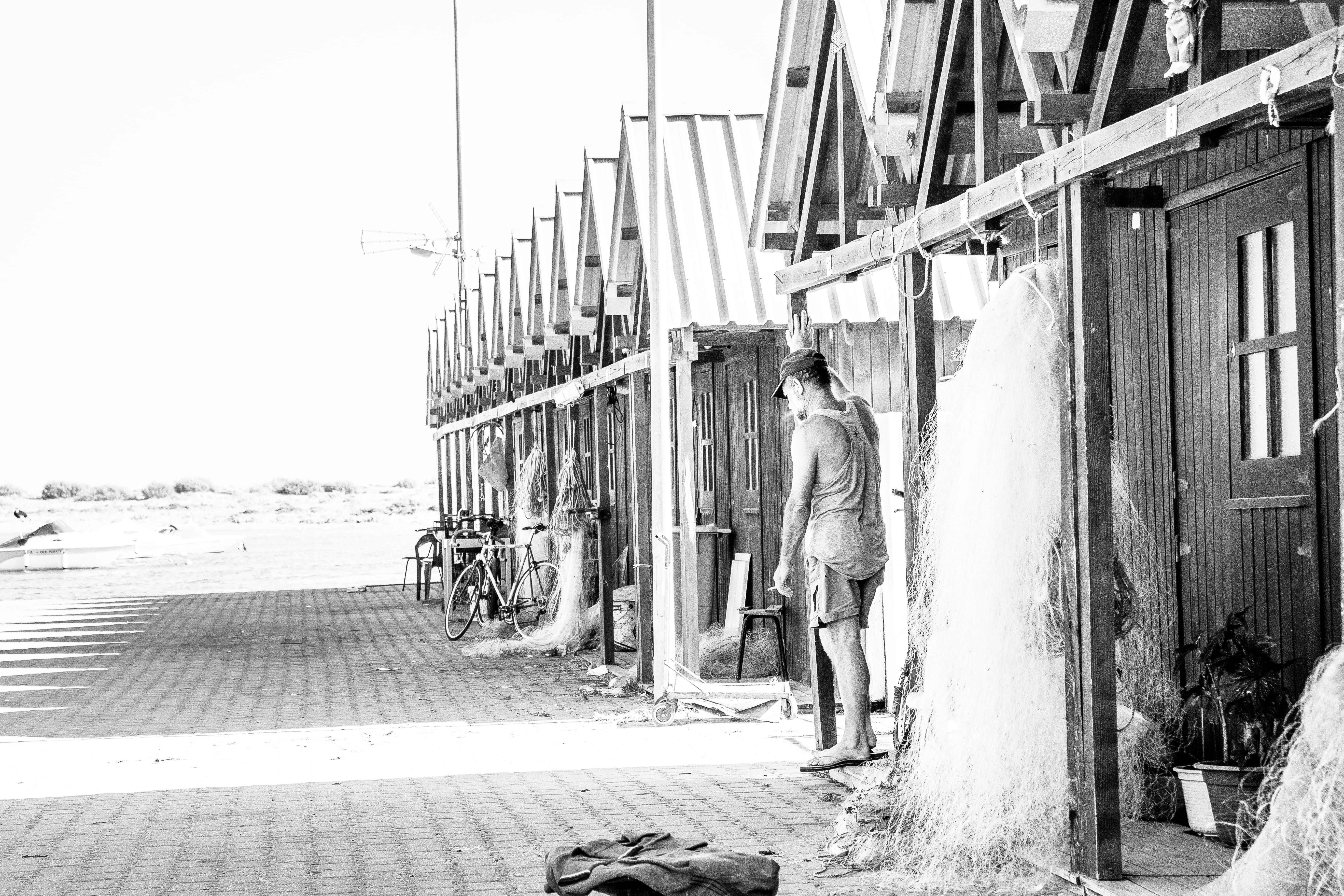 adult, outdoors, bandw, cabanas de tavira, men, walking, algarve, smoke, day, people, street, two people, footpath, fisherman, building exterior, full length, HD Wallpaper