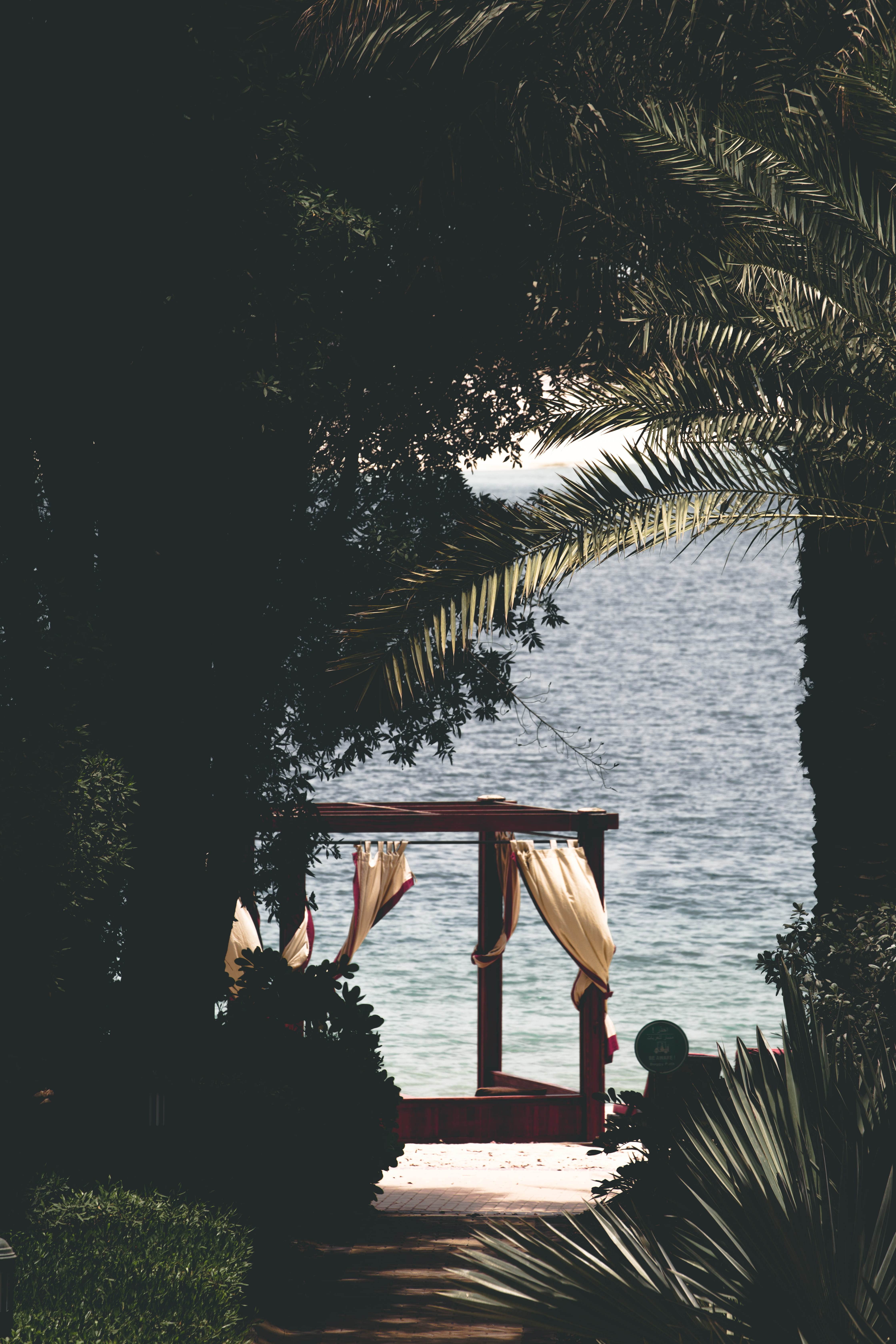 water, daytime, women, beach, tranquility, architecture, trees, background, day, people, horizon, beauty in nature, dark, 5K, cabana, green, Phone HD Wallpaper