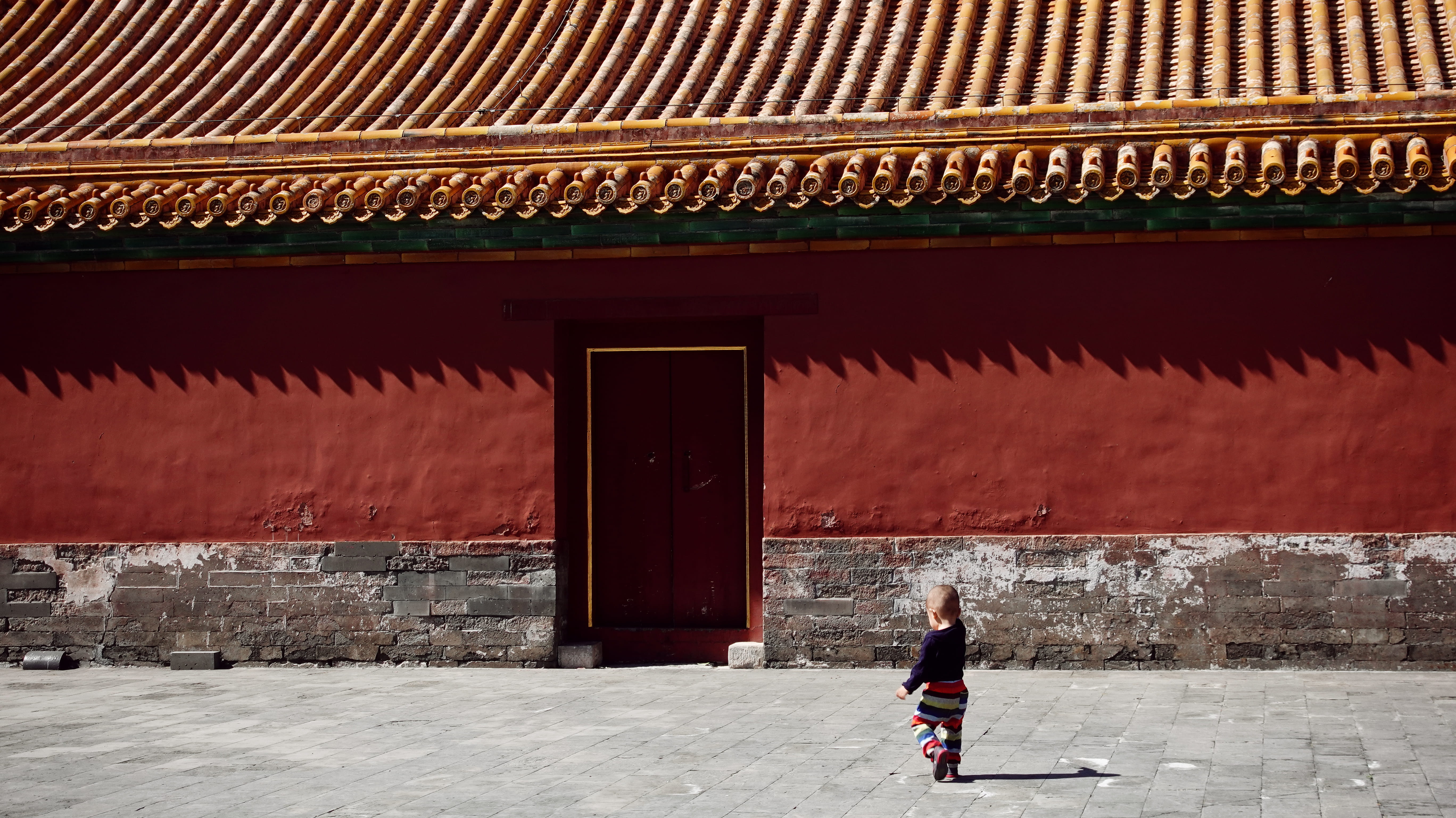 walking, walkway, red, leisure activity, 5K, sidewalk, men, baby, built structure, real people, wall, rear view, alley, temple, full length, brick, building exterior, HD Wallpaper