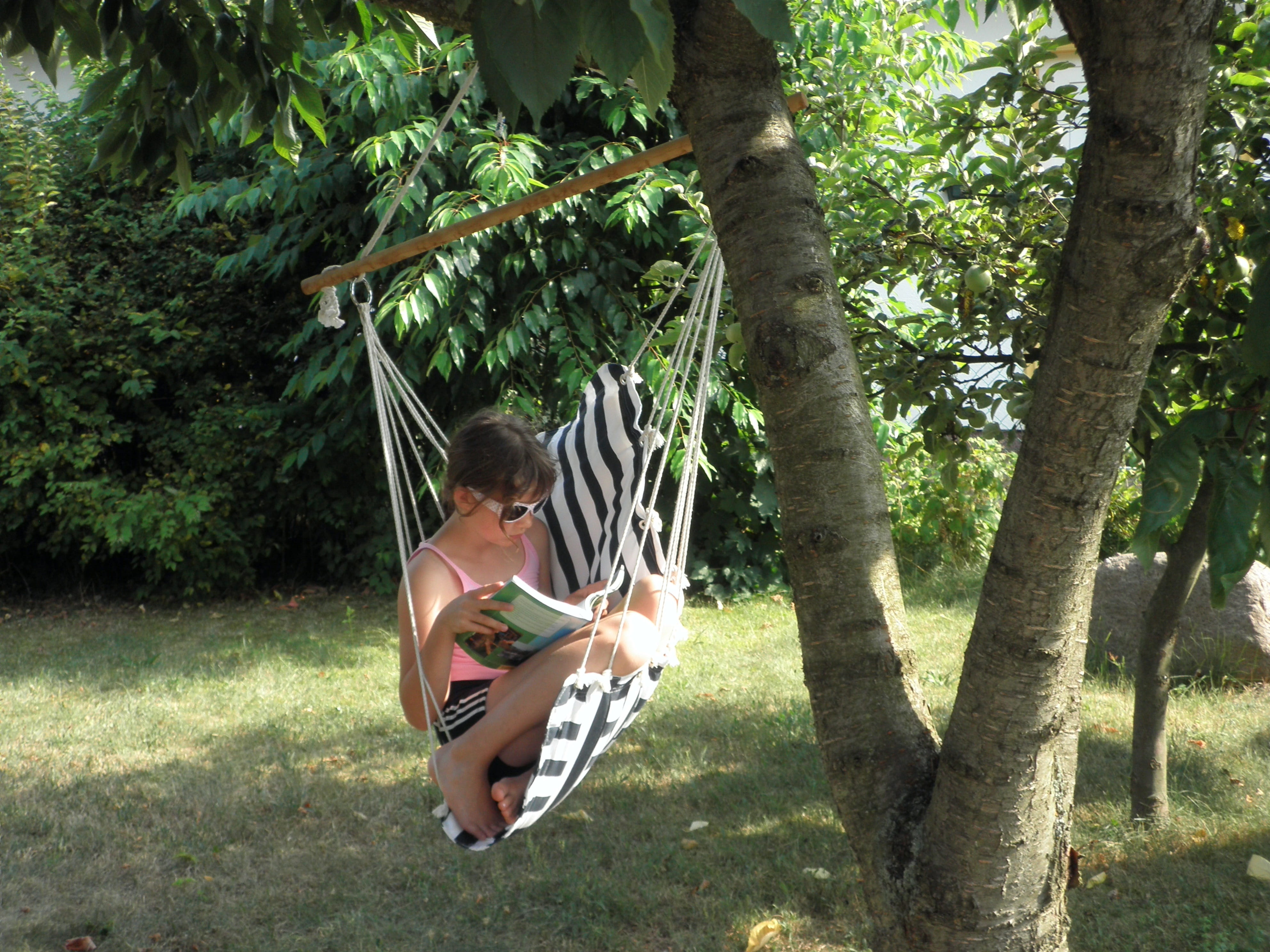 garden, tank top, riding, growth, read, sunlight, hammock, children only, full length, day, girl, pink tank, tank, land, real people, under the tree, one person, HD Wallpaper