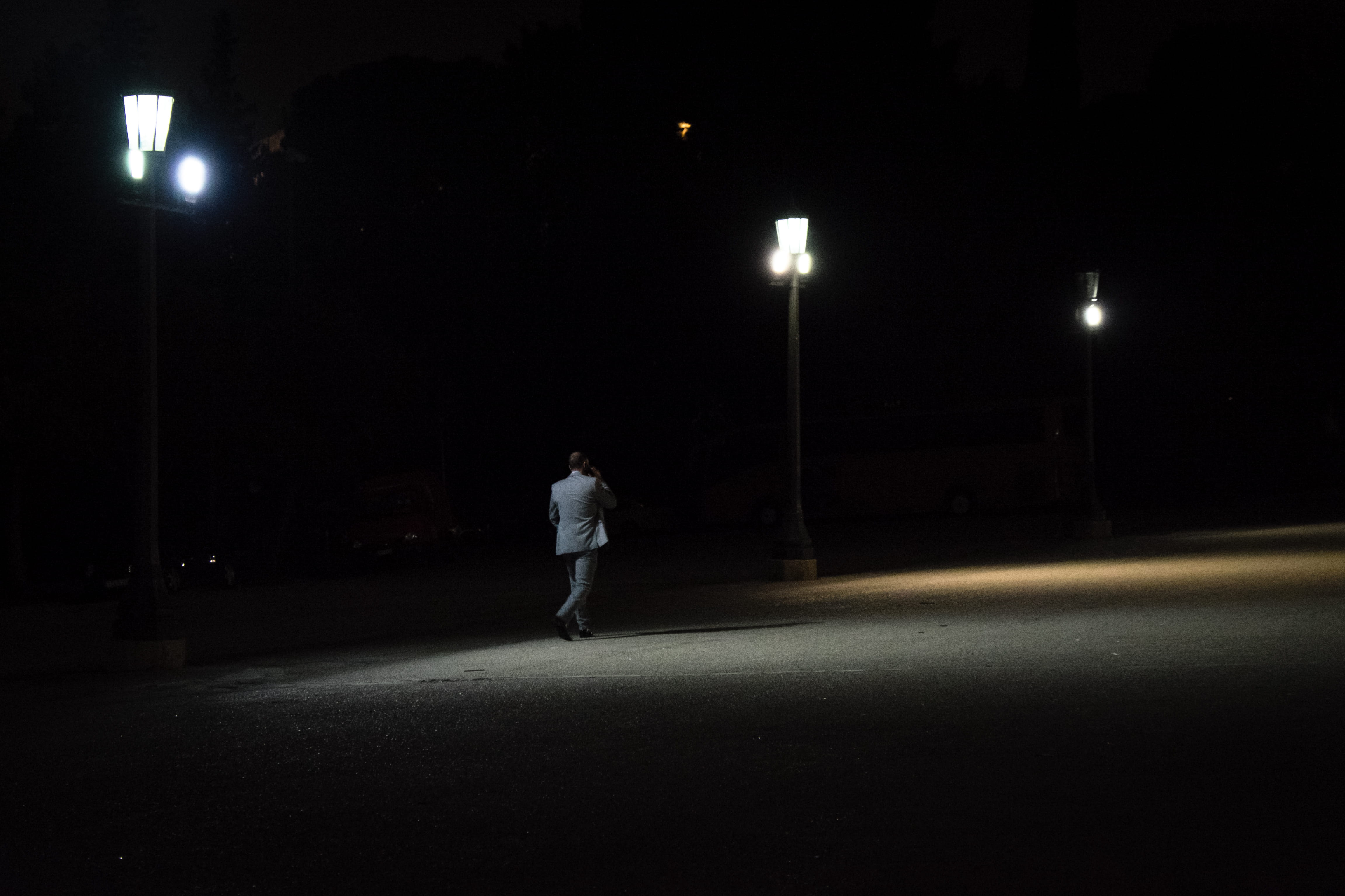 men, street light, city, light, full length, motion, transportation, dark, walking, athens, casual clothing, one person, illuminated, lighting equipment, HD Wallpaper