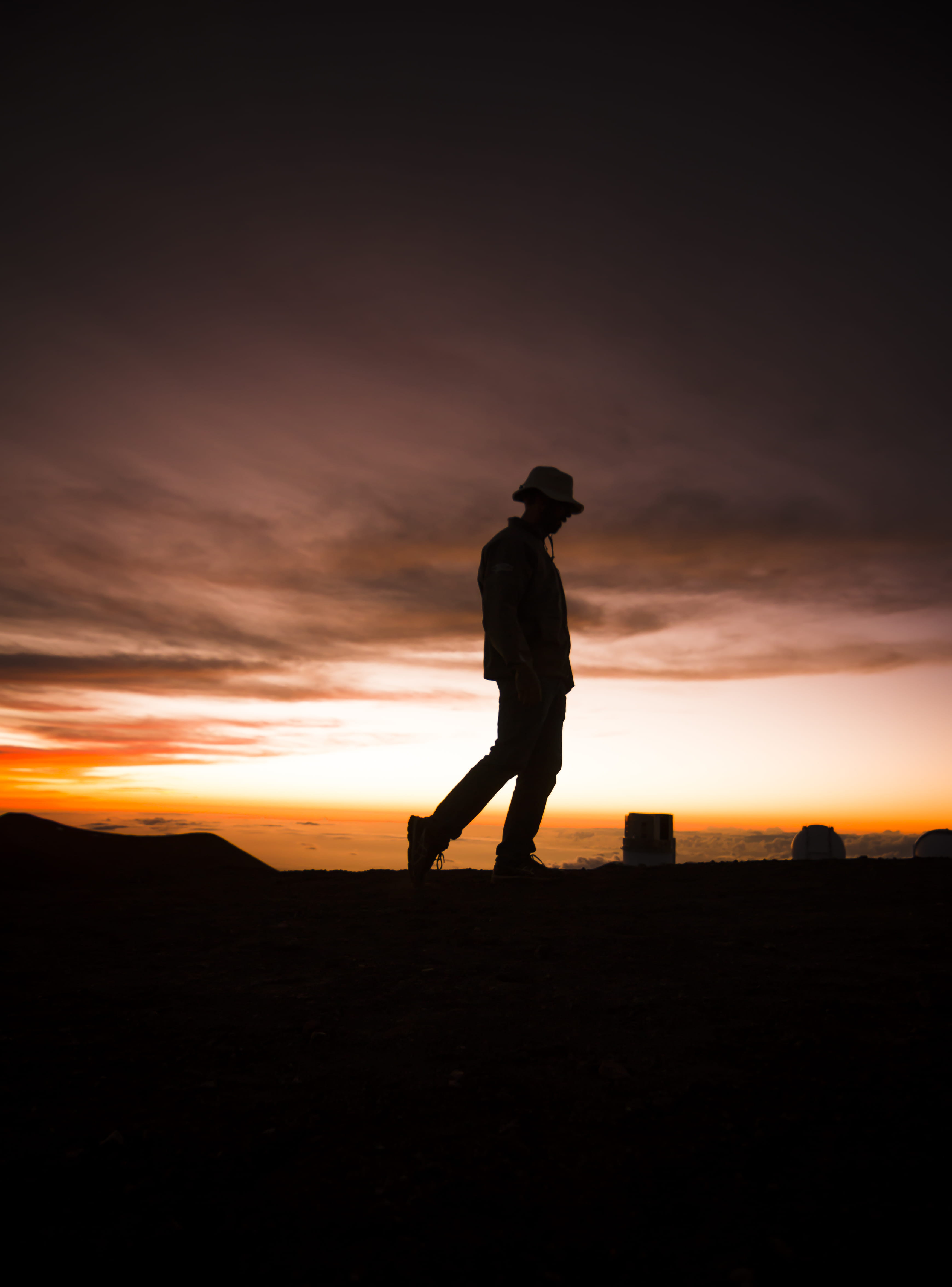 walking, tranquil scene, beauty in nature, land, shiloette, standing, sunset, one person, orange color, clouds, united states, mountain, sky, silhouette, Phone HD Wallpaper