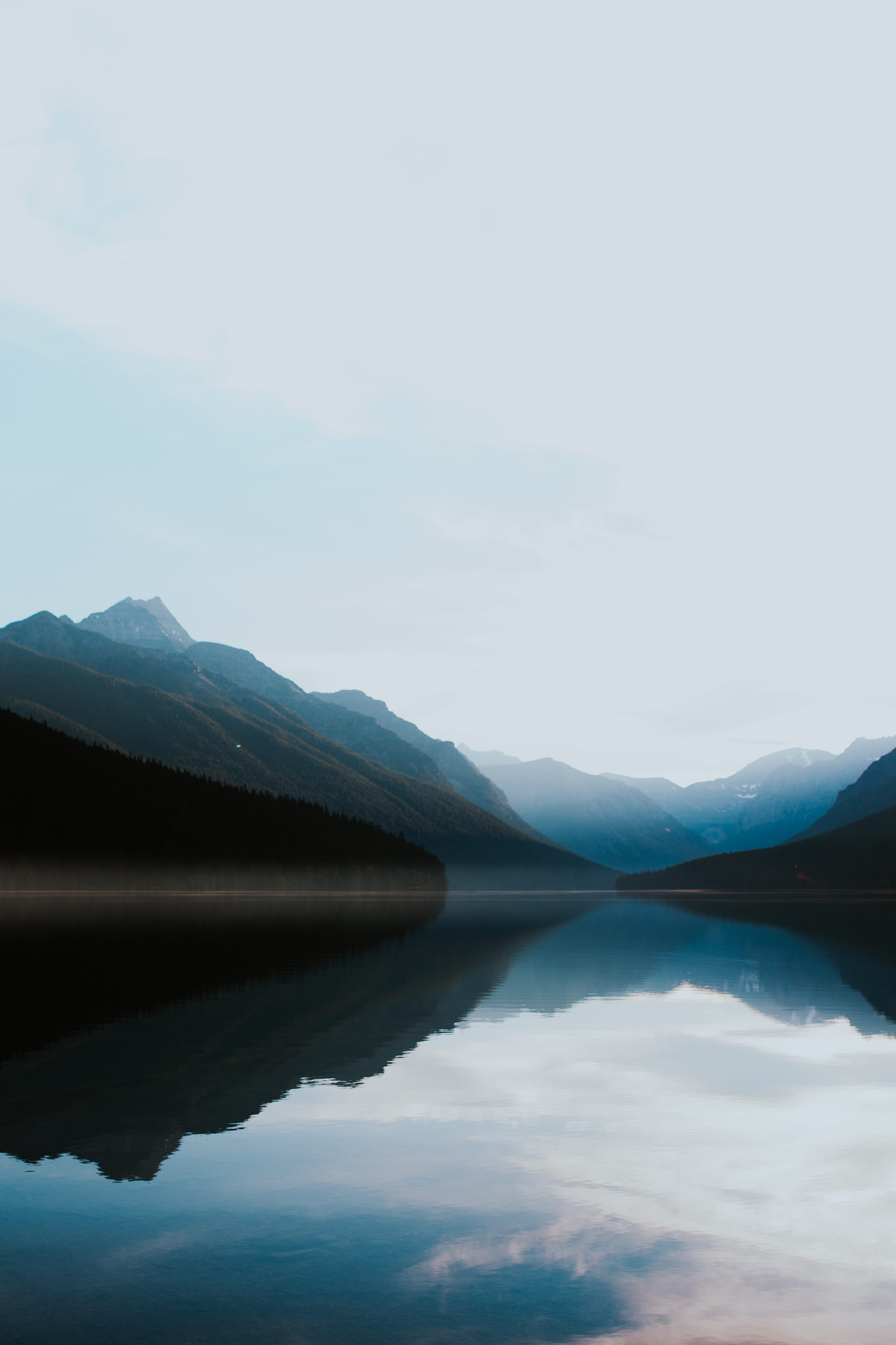 remote, surrounded, 4K, no people, bowman lake, beauty in nature, montana, photo, idyllic, day, forest, mountains, mountain range, scenics - nature, nature, Phone HD Wallpaper