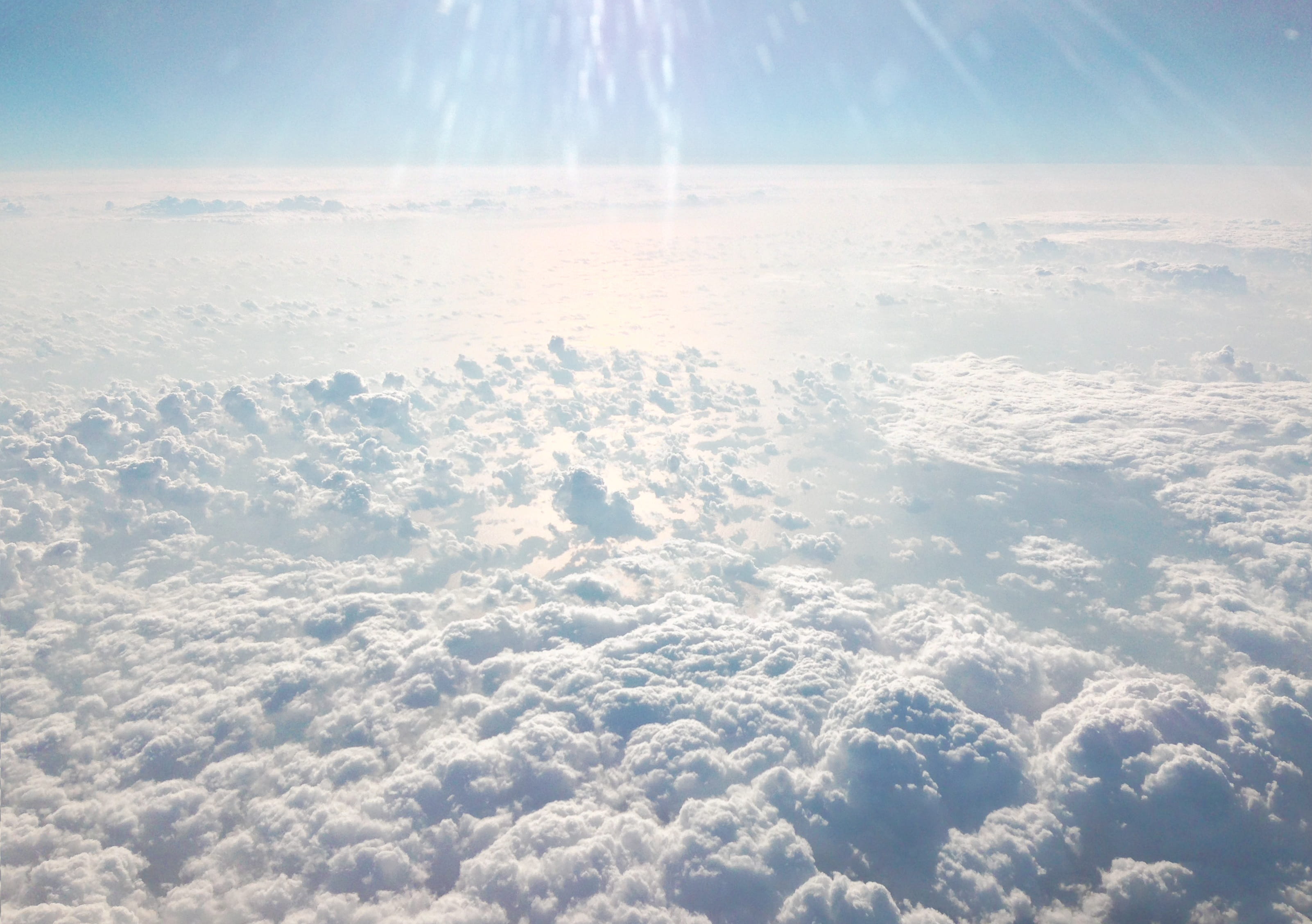above the clouds, tranquility, cloud - sky, lens flare, clear skies, blue, no people, fantastic, 2K, cloudscape, blue sky, nature, meteorology, white color, HD Wallpaper