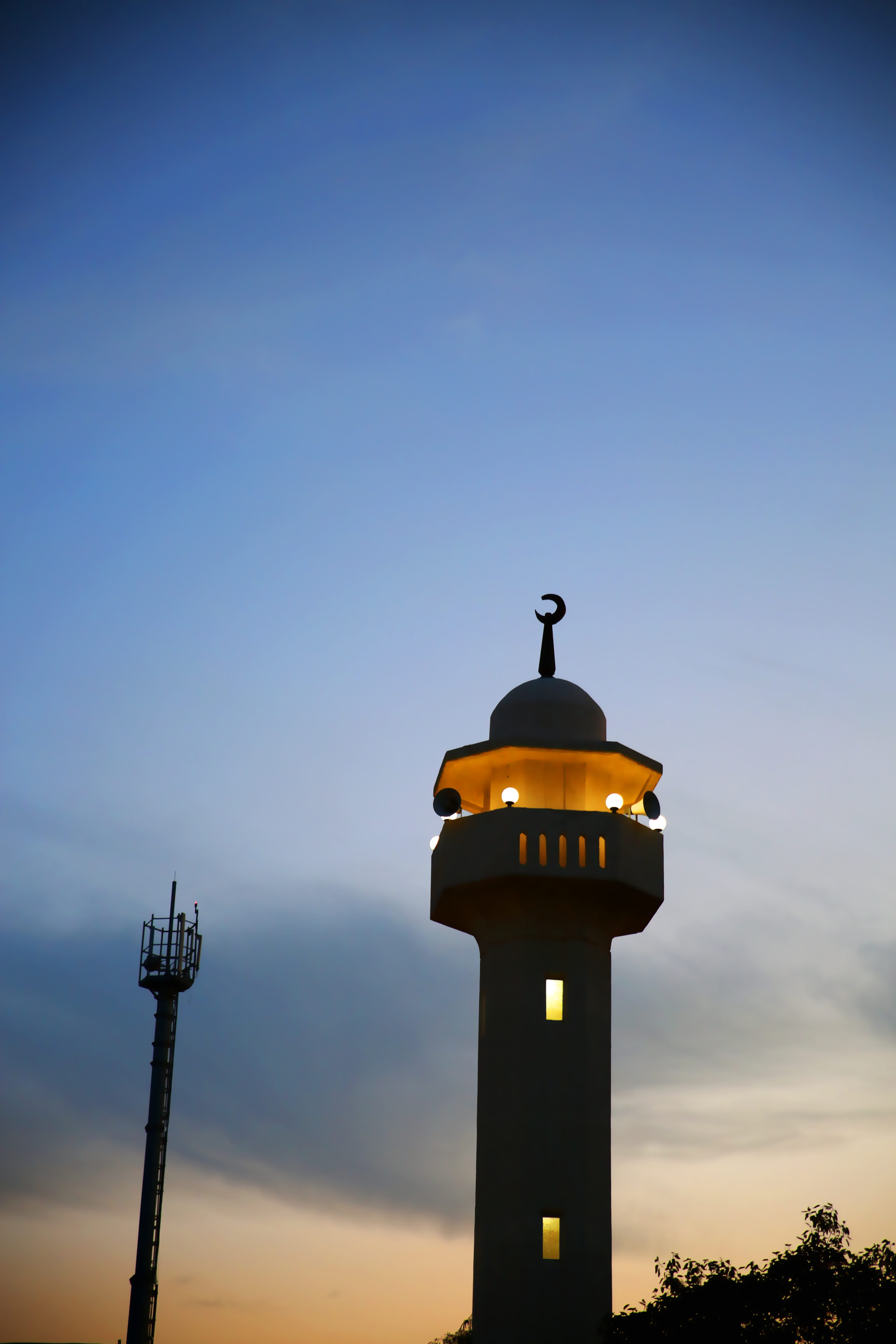 no people, dusk, tower, building exterior, #eveningsky, orange color, sunset, spire, low angle view, built structure, mangaf, lighting equipment, kuwait, Phone HD Wallpaper
