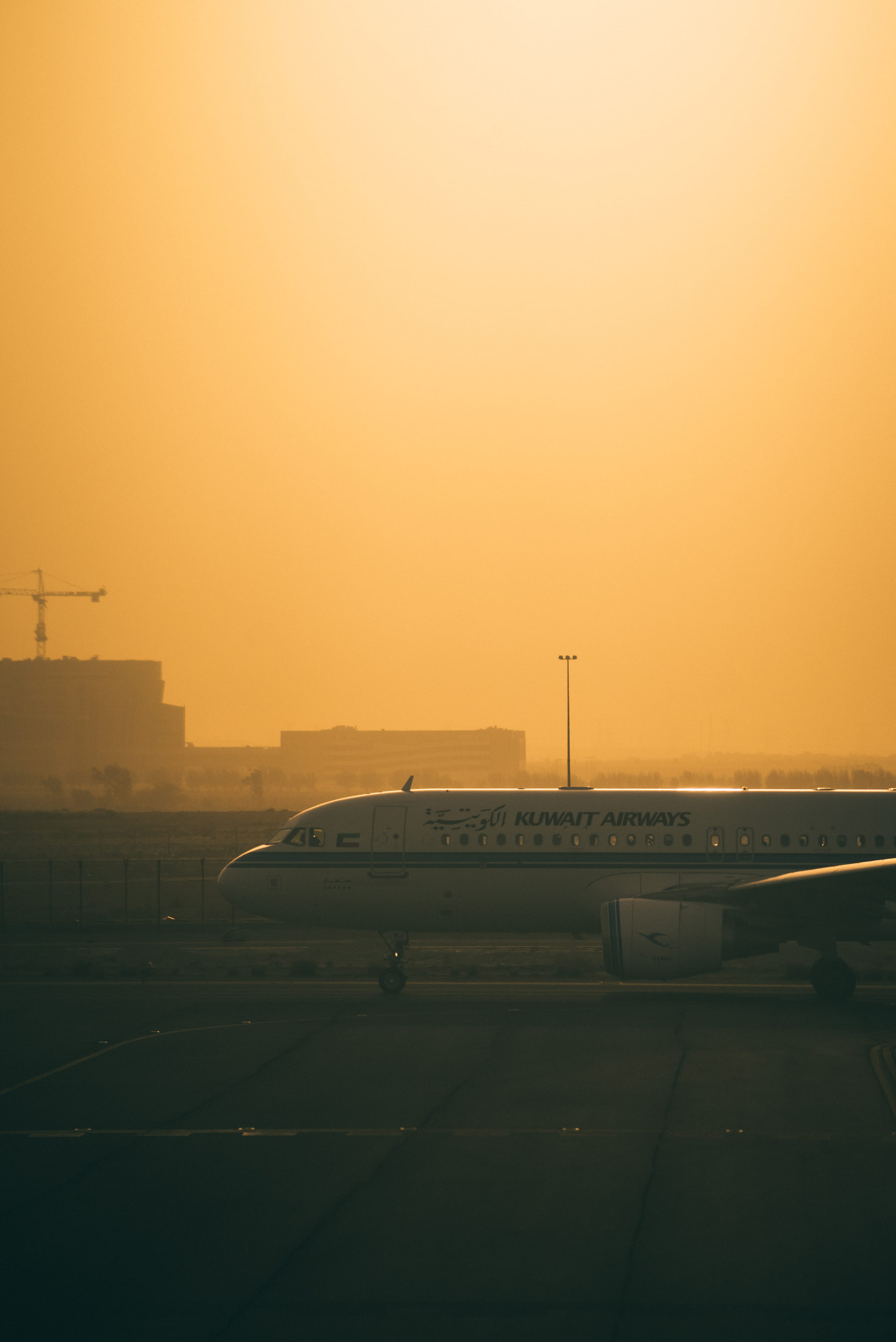 scenics - nature, outdoors, yellow, architecture, built structure, airplane, airport, parked, orange color, person, clear sky, no people, airways, orange, Phone HD Wallpaper