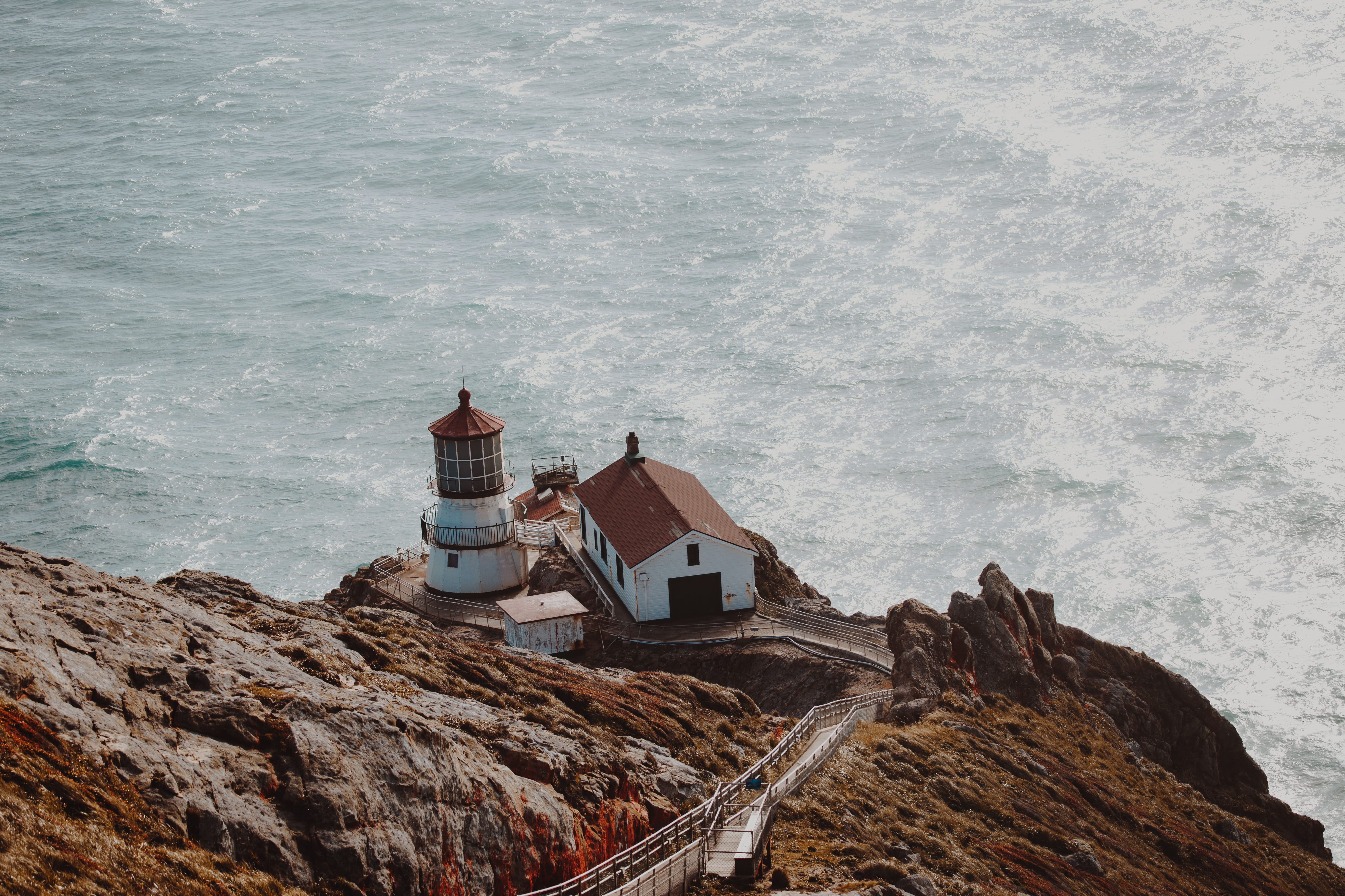 concrete, near, water, lighthouse, shipping, aerial, solid, beacon, sea, white, beauty in nature, californium, rock, mountain, wave, house, outdoors, beside, HD Wallpaper
