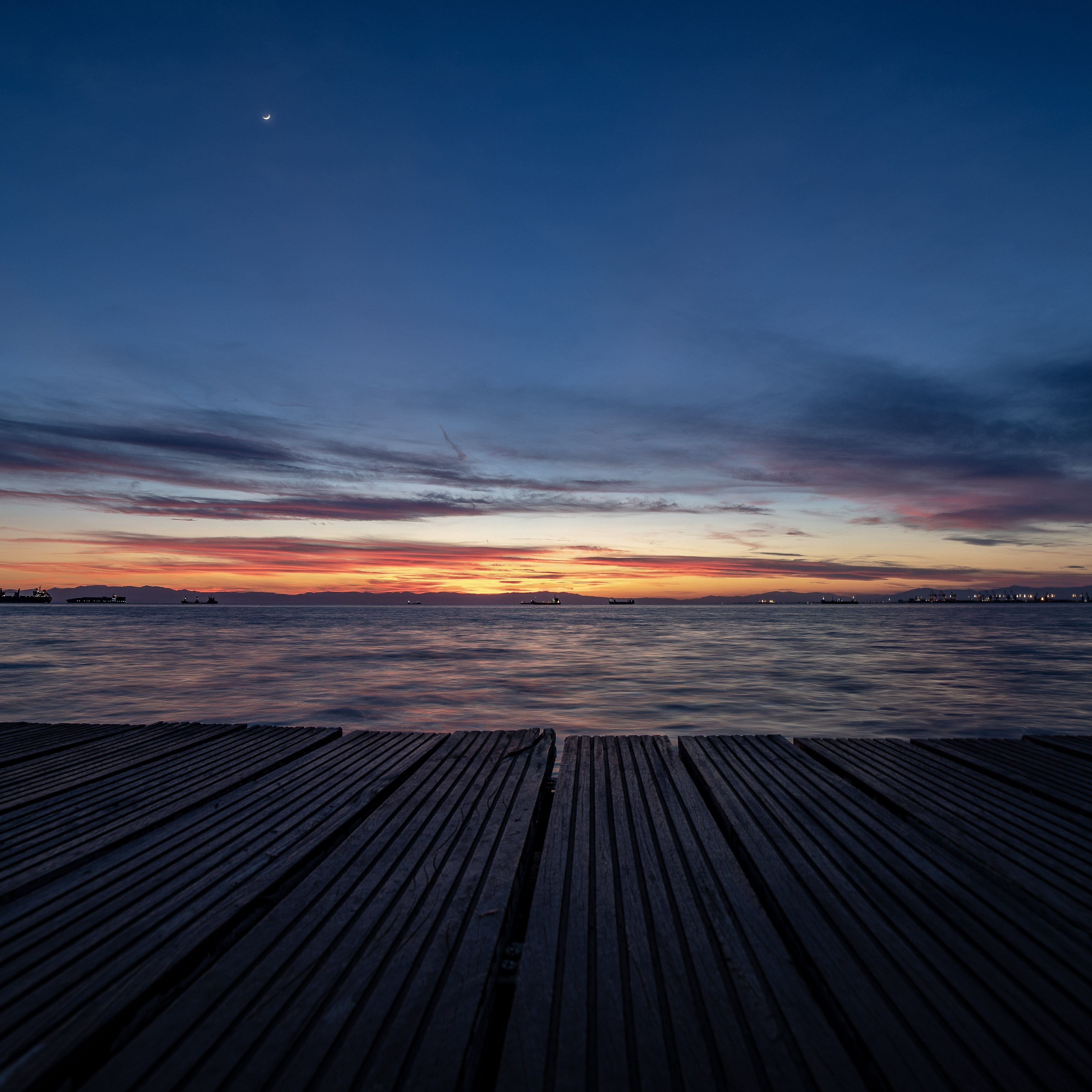 electrical device, night, dramatic sky, outdoors, boardwalk, porch, deck, waterfront, scenics - nature, nostalgia, no people, water, solar panels, red sky, Phone HD Wallpaper