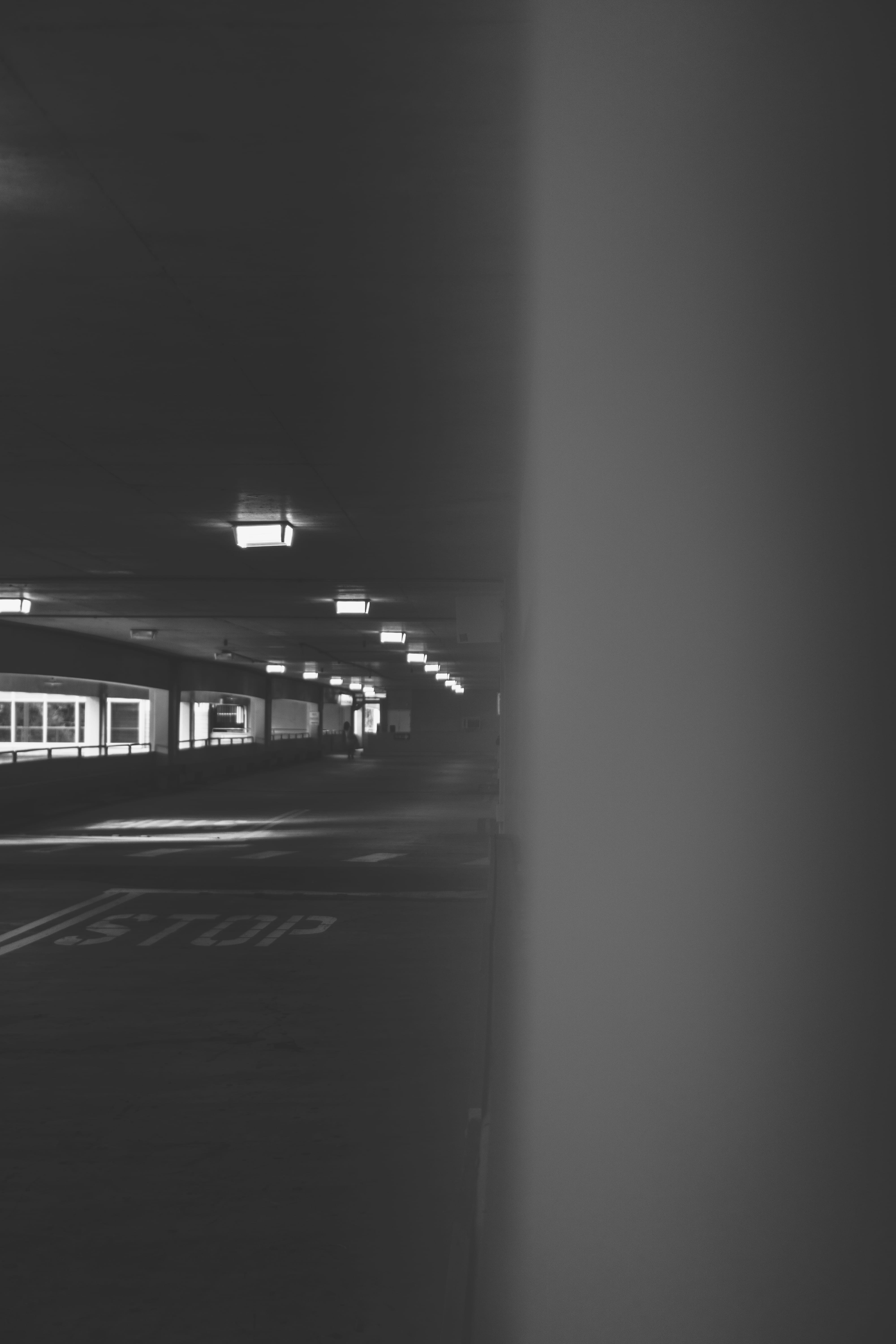 dark, light, illuminated, night, built structure, grayscale, lighting, parking garage, building, motion, tarmac, building exterior, tunnel, the way forward, Phone HD Wallpaper