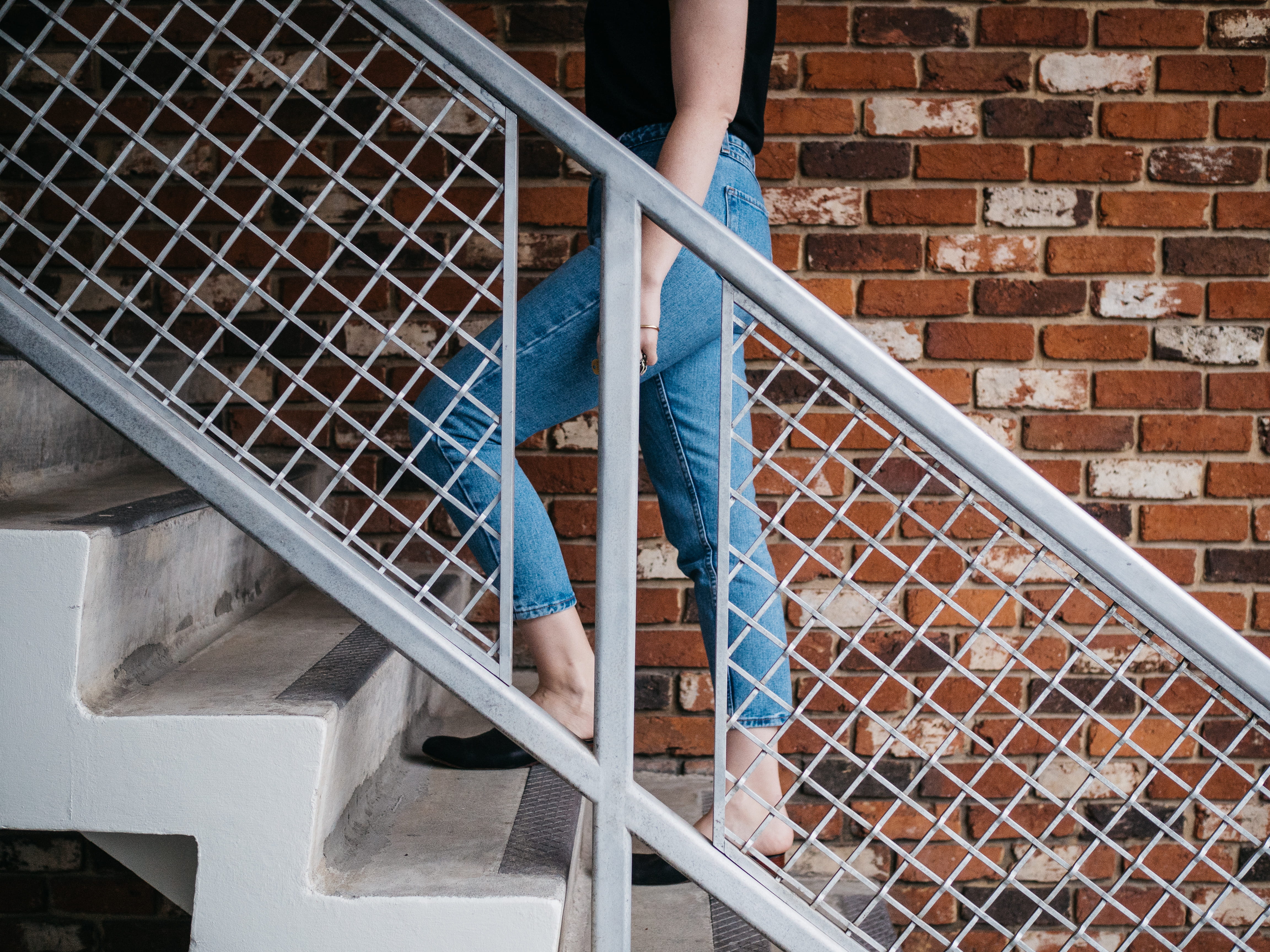 near, brick, upstairs, railling, metal, real people, adult, one person, leisure activity, architecture, lifestyles, going, built structure, stair well, HD Wallpaper