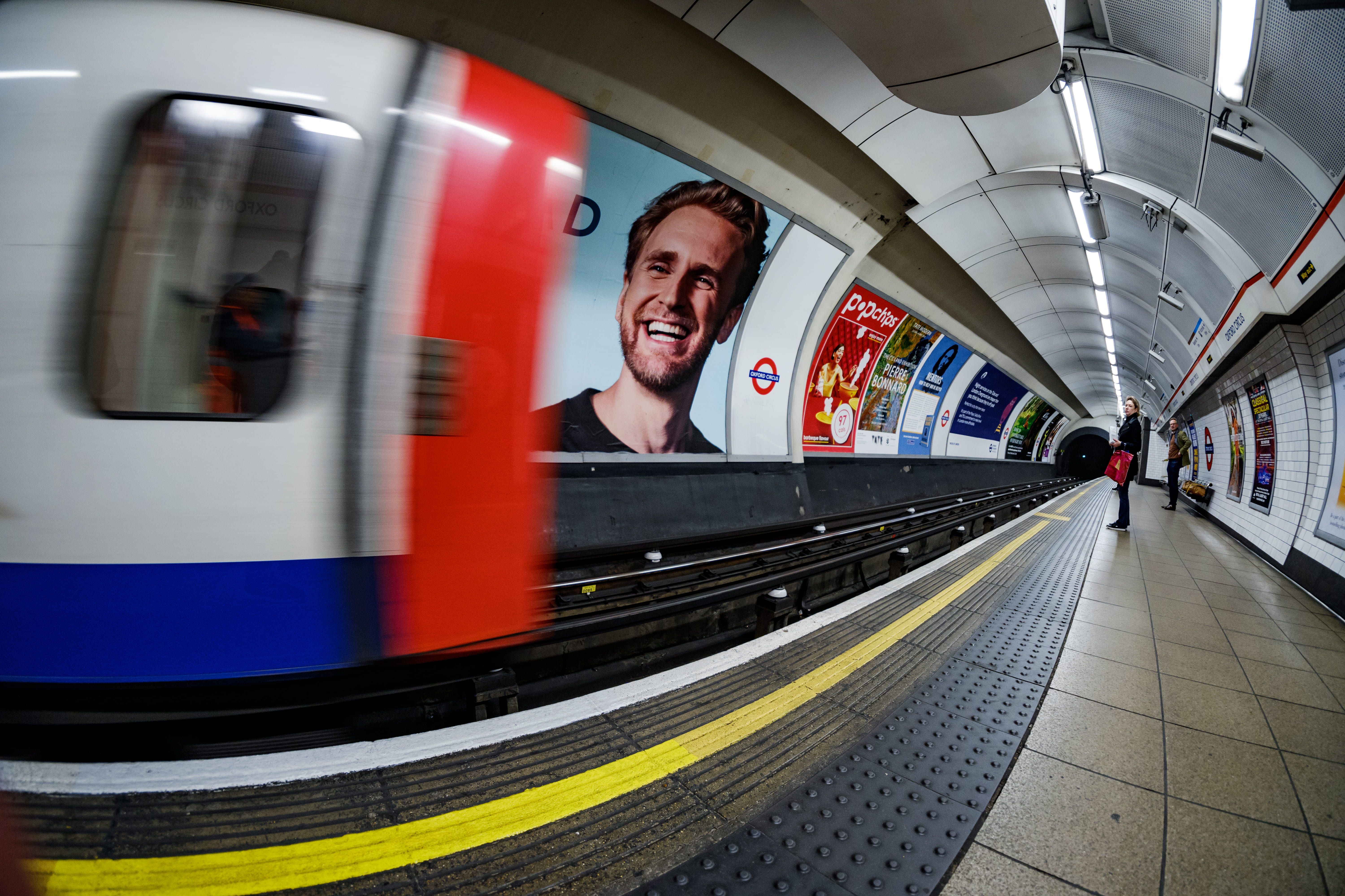 young men, standing, banister, lighting, travel, clothing, coat, young adult, subway, train station, handrail, transportation, blurred motion, london underground tube wideangle fisheye fuji fujifilm, HD Wallpaper