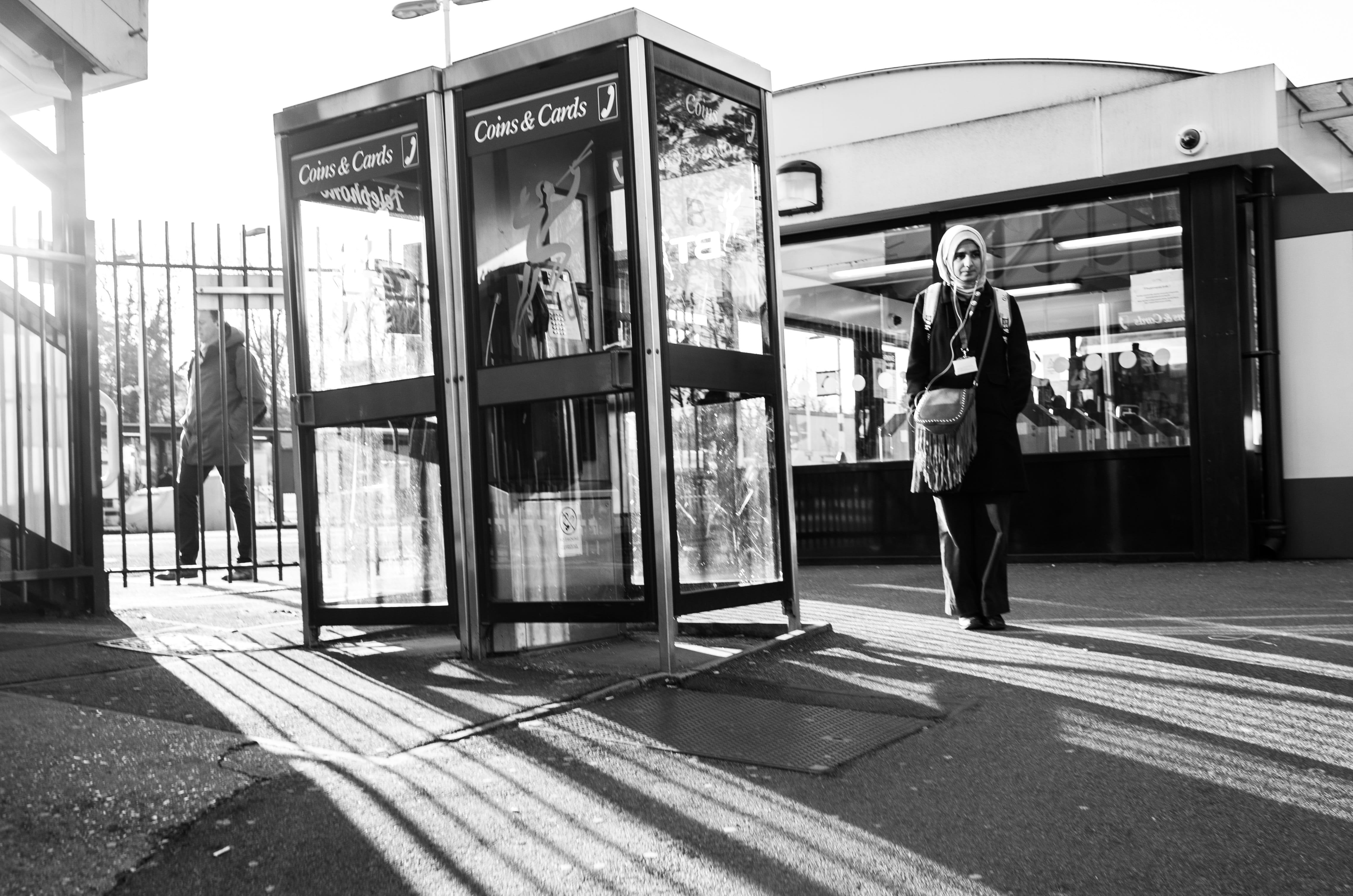 building exterior, coat, real people, reflection, built structure, clothing, store, lifestyles, one person, overcoat, road, kiosk, chair, path, human, person, HD Wallpaper