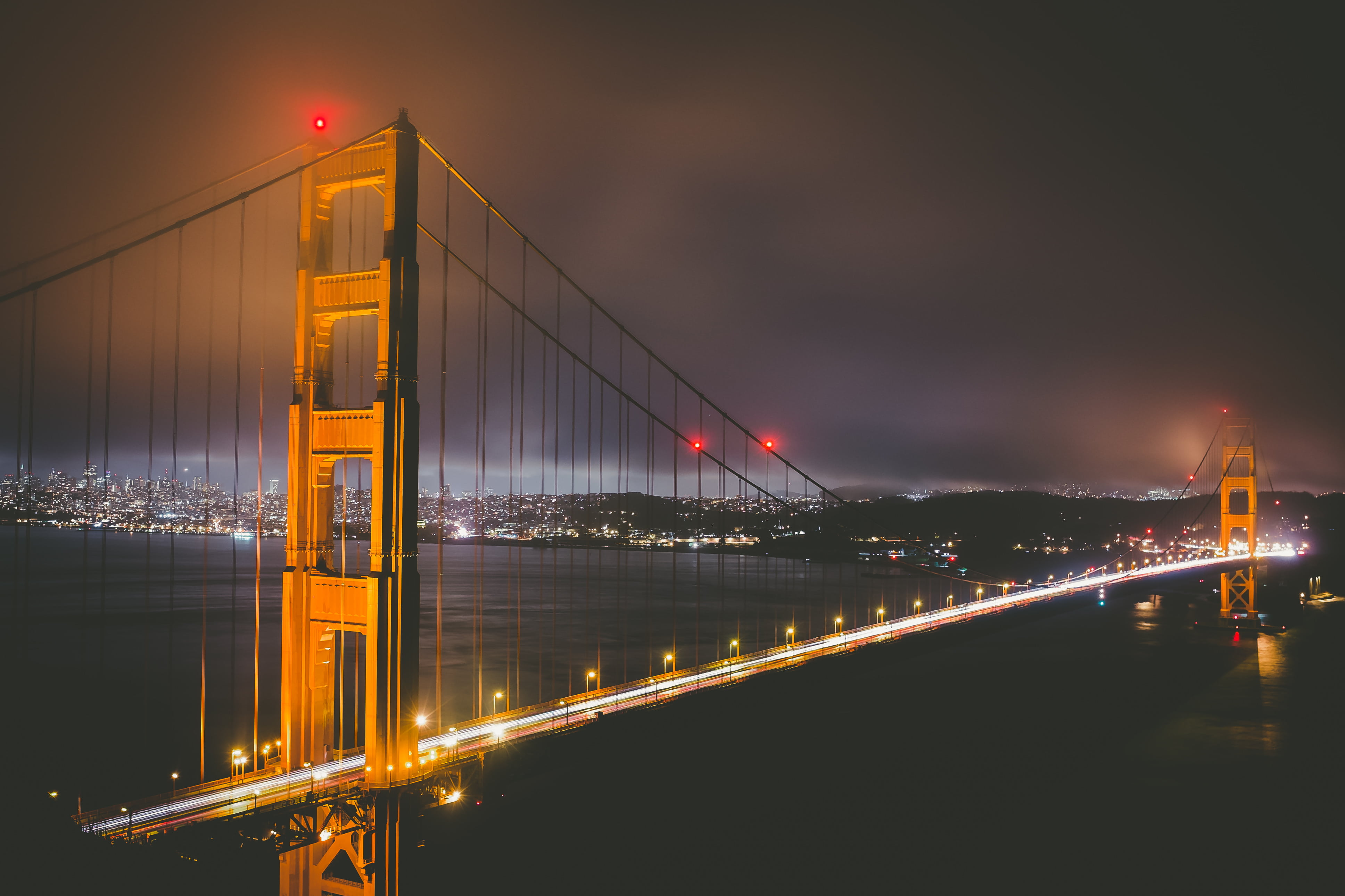 bridge, building exterior, golden gate bridge, suspension Bridge, urban Skyline, light trail, famous Place, cityscape, illuminated, sea, sky, outdoors, HD Wallpaper