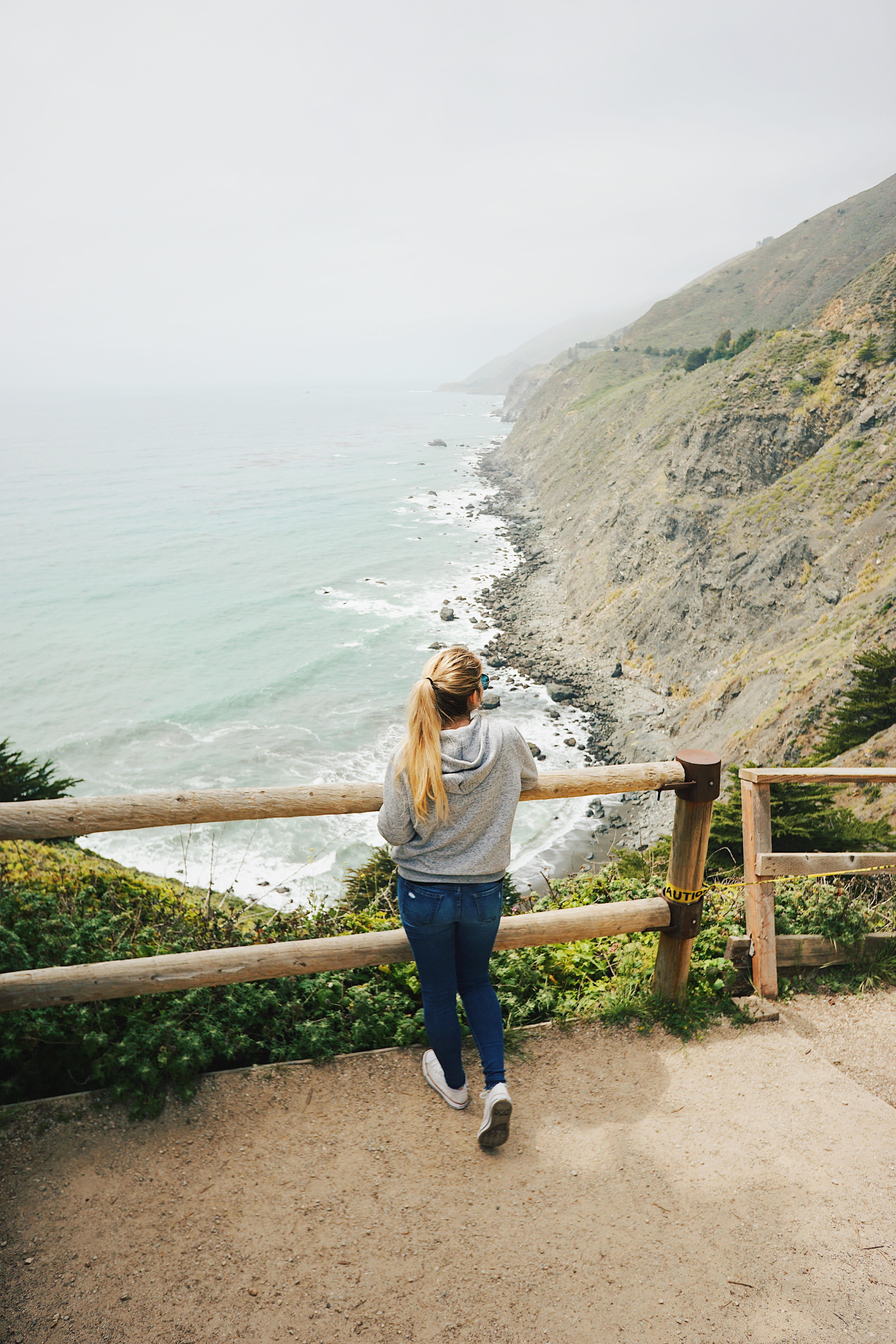 lifestyles, full length, blonde, waves, rear view, jeans, sky, standing, rocks, coastline, shoreline, beauty in nature, casual clothing, outdoors, hair, Phone HD Wallpaper