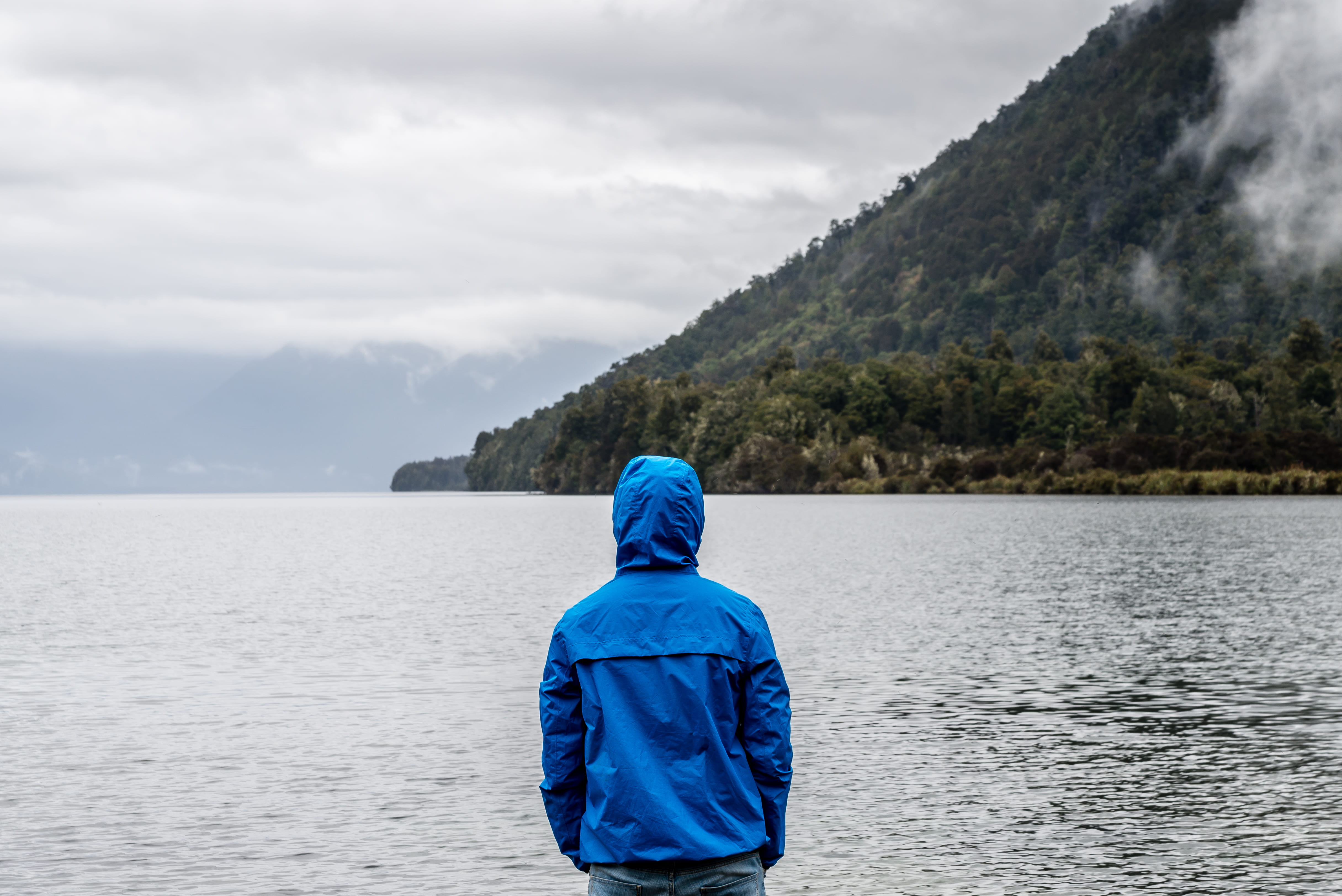 water, mist, weather, misty, mountain, clothing, hoodie, body, fog, real people, clouds, back, hood, recreation, rainy day, loneliness, island, outdoors, HD Wallpaper