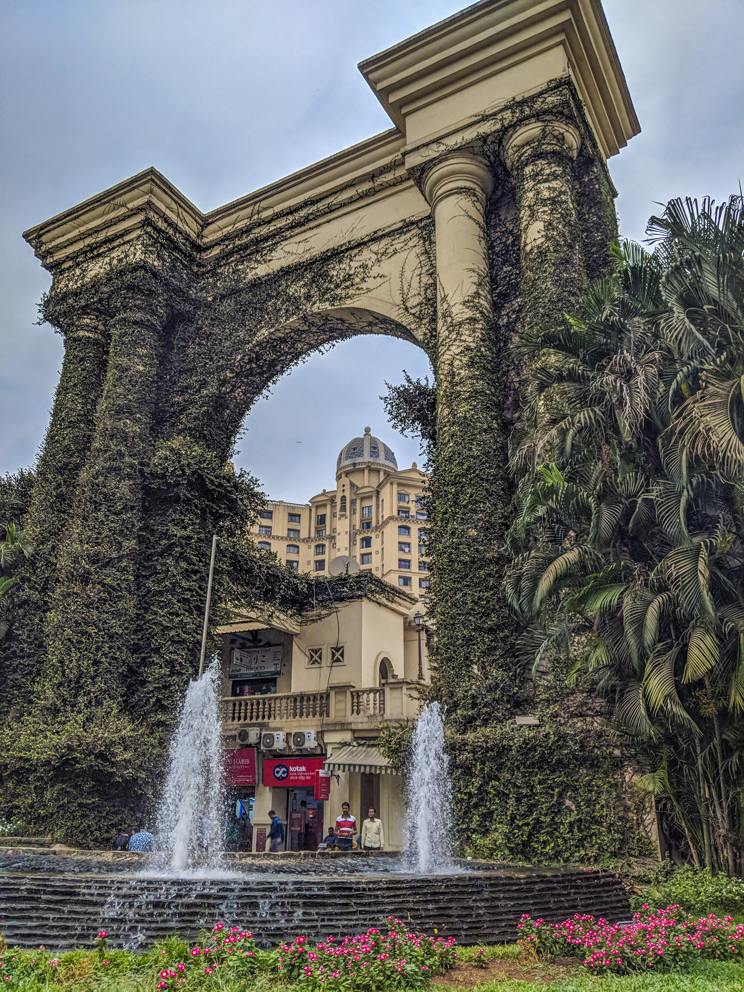 india, architecture, low angle view, hiranandani gardens, flowing water, built structure, motion, travel destinations, 4K, day, mumbai, no people, arch, Phone HD Wallpaper