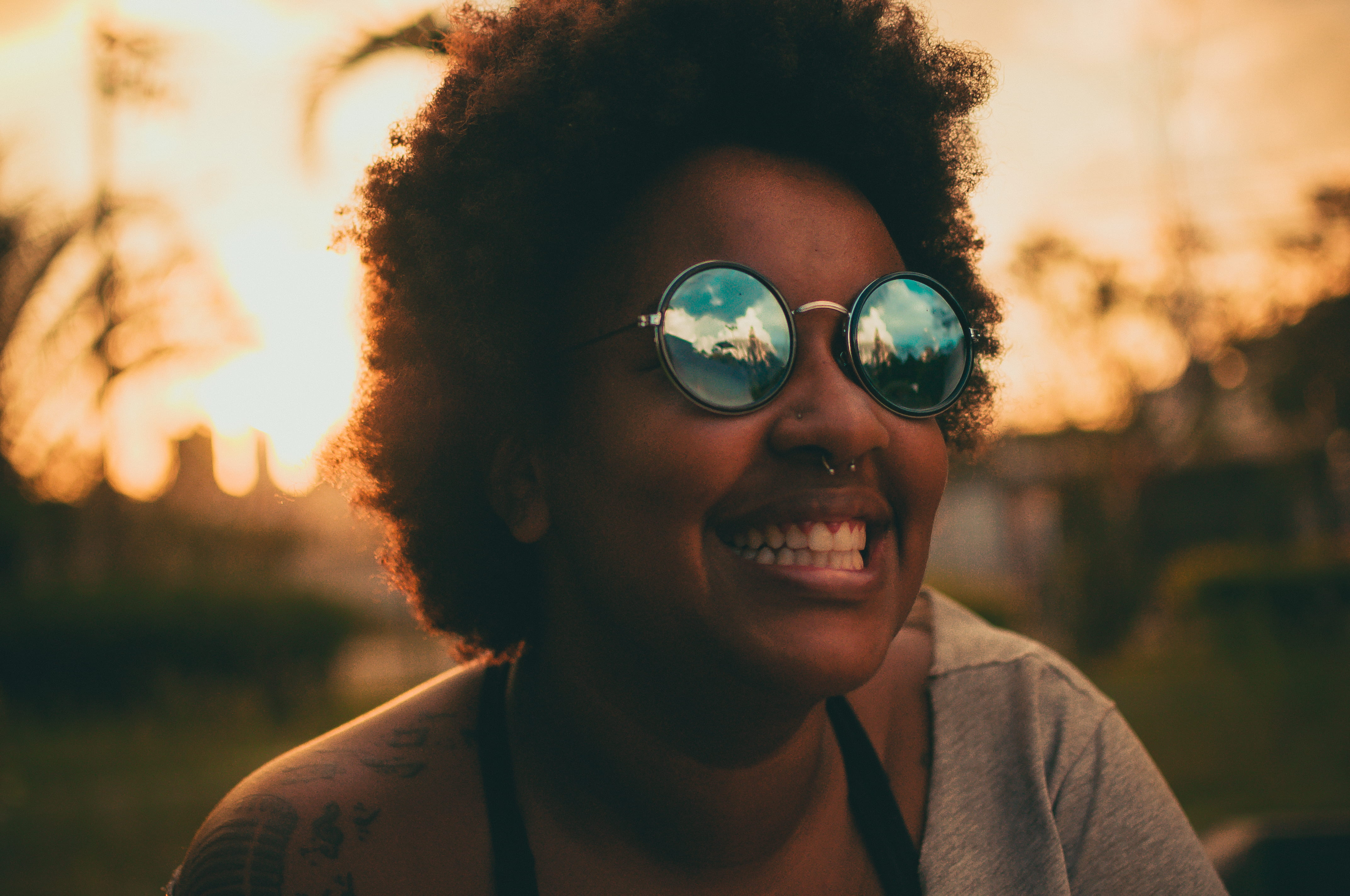 glasses, wearing, happy, outdoors, girl, eyewear, woman, sky, curly hair, emotion, fun, focus on foreground, sunglasses, face, close-up, lens flare, fashion, HD Wallpaper