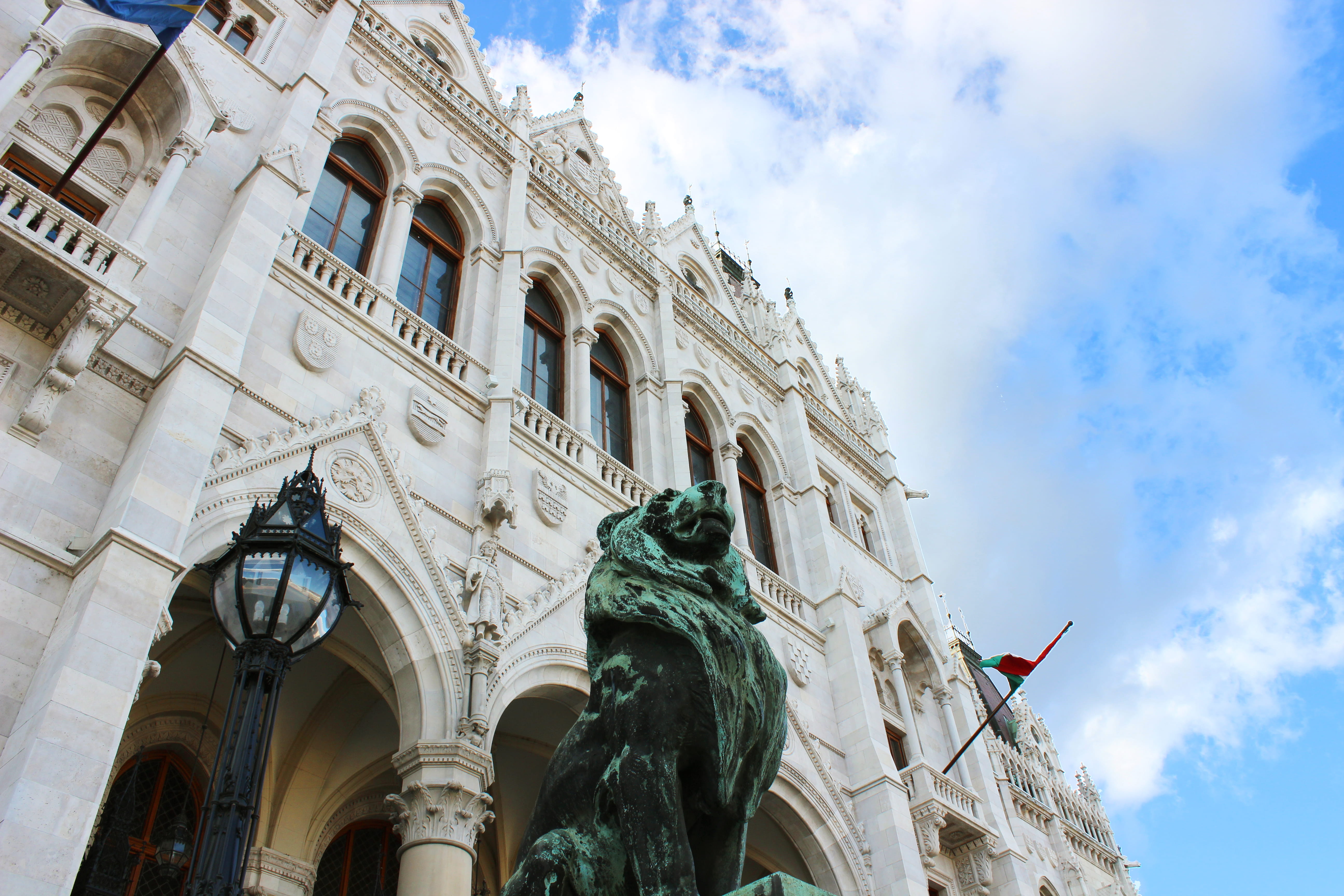 hungary, day, low angle view, 5K, sculpture, travel destinations, flag, outdoors, monumental, budapest, parliament, residence parliament, cloud - sky, HD Wallpaper