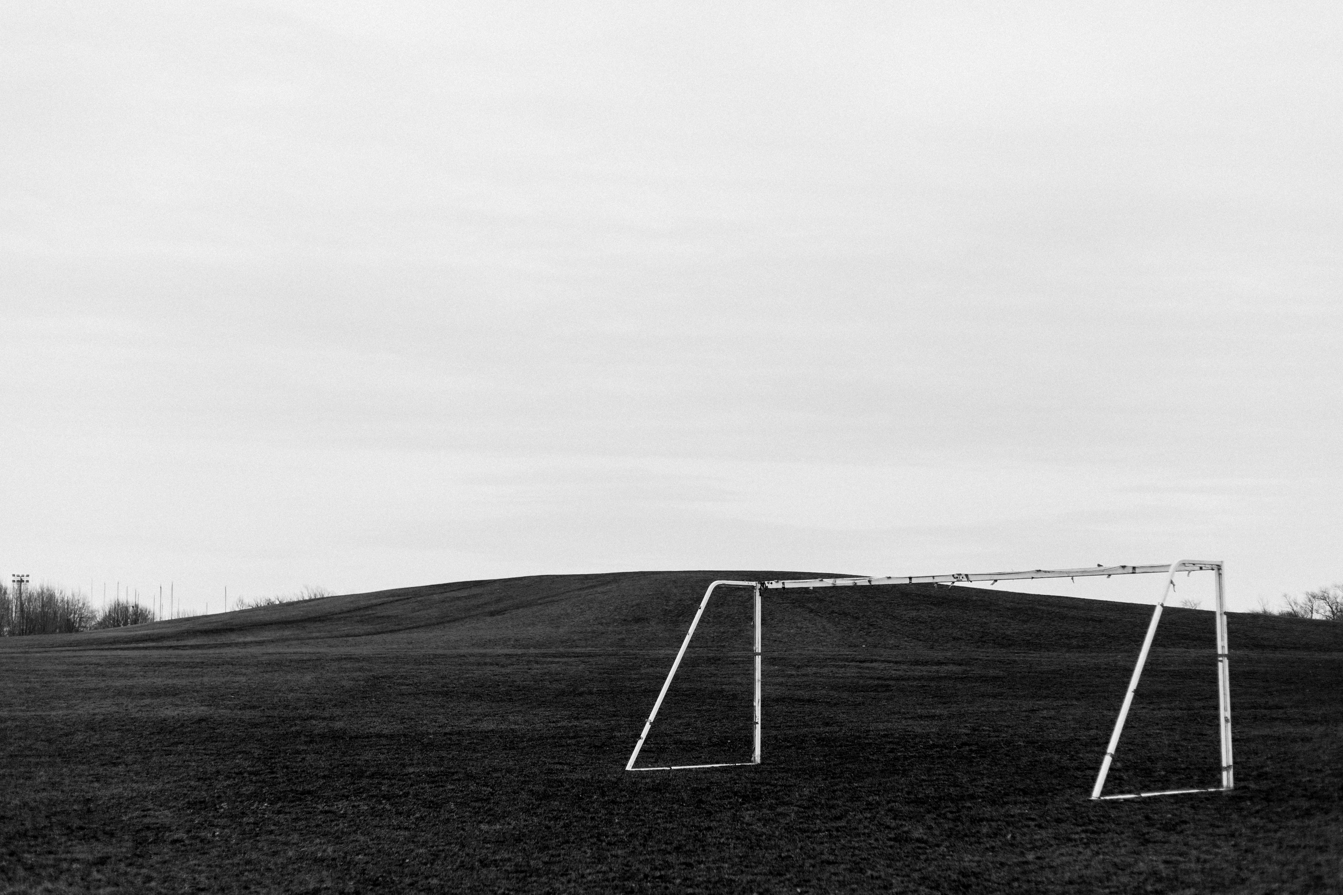 day, sky, grayscale, outdoors, environment, nature, 5K, goalpost, tranquility, ground, team sport, soccer, football, no people, elevated, soccer field, HD Wallpaper