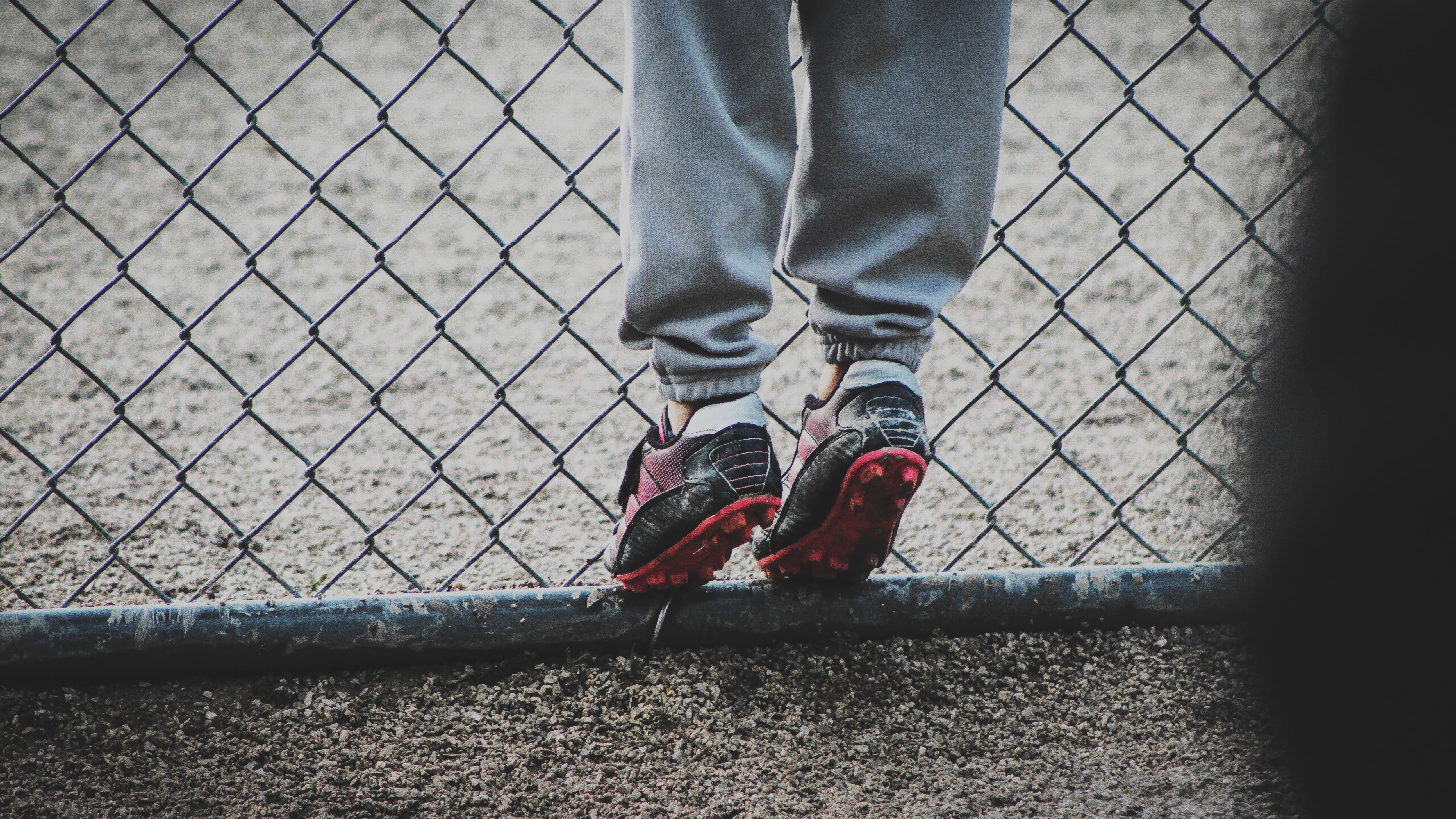 shoe, exercising, sports Shoe, boots, red, jogging, metal, fence, body part, one Person, 5K, human Leg, unrecognizable Person, football, standing, feet, HD Wallpaper