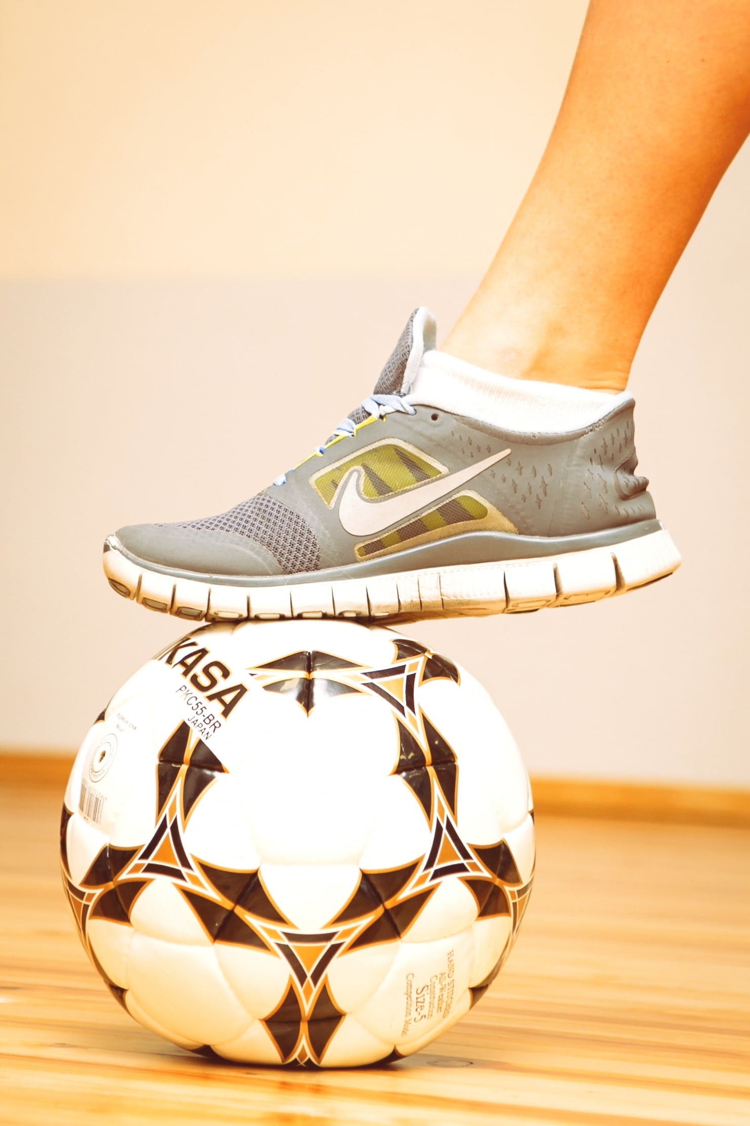sport, women, gold colored, close-up, indoors, football, one person, low section, human body part, leg, body part, soccer ball, 1080P, ball, leisure activity, Phone HD Wallpaper