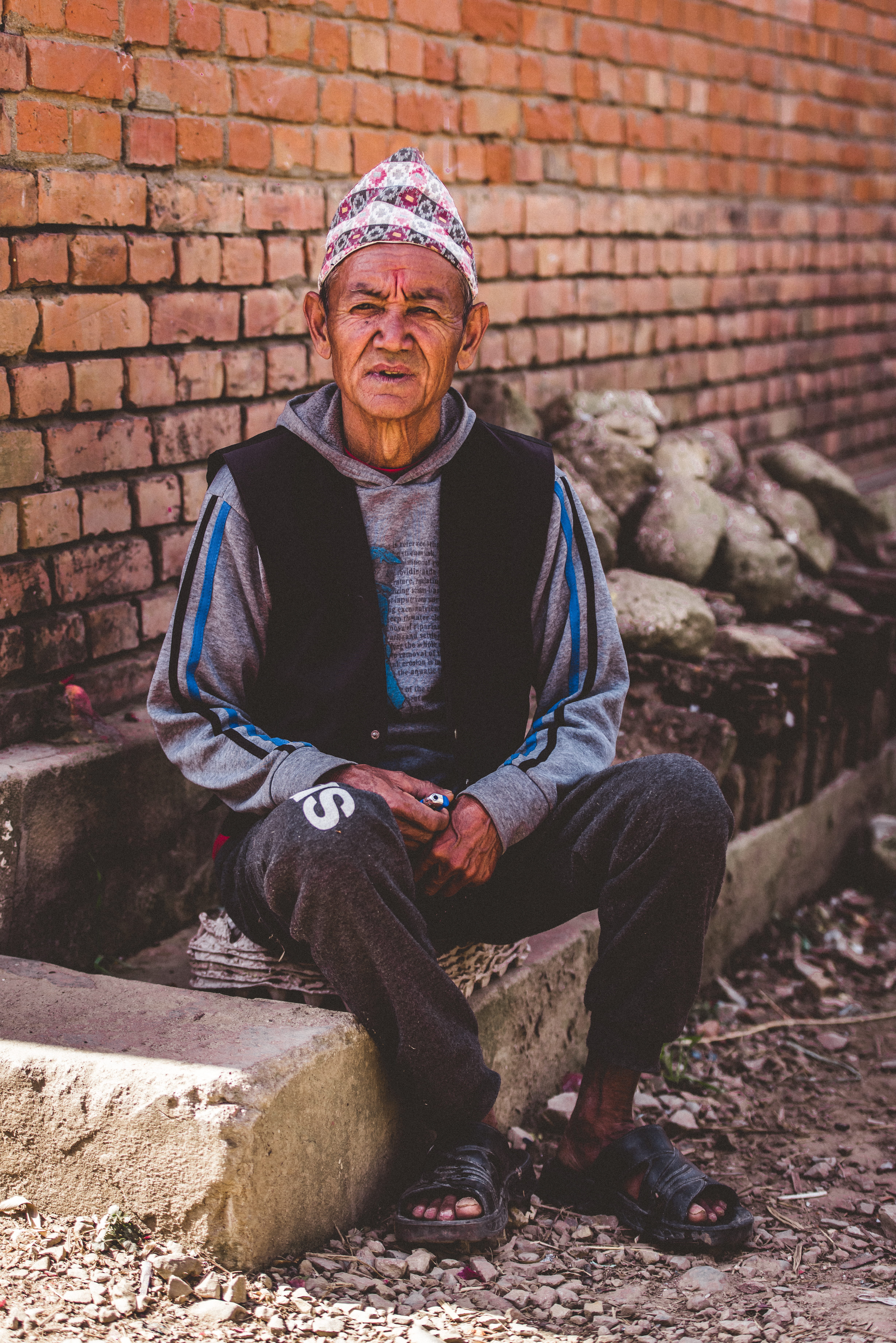 mature men, lifestyles, casual clothing, concrete, portrait, bokeh, sitting, males, old, front view, wall, full length, architecture, man, looking at camera, Phone HD Wallpaper