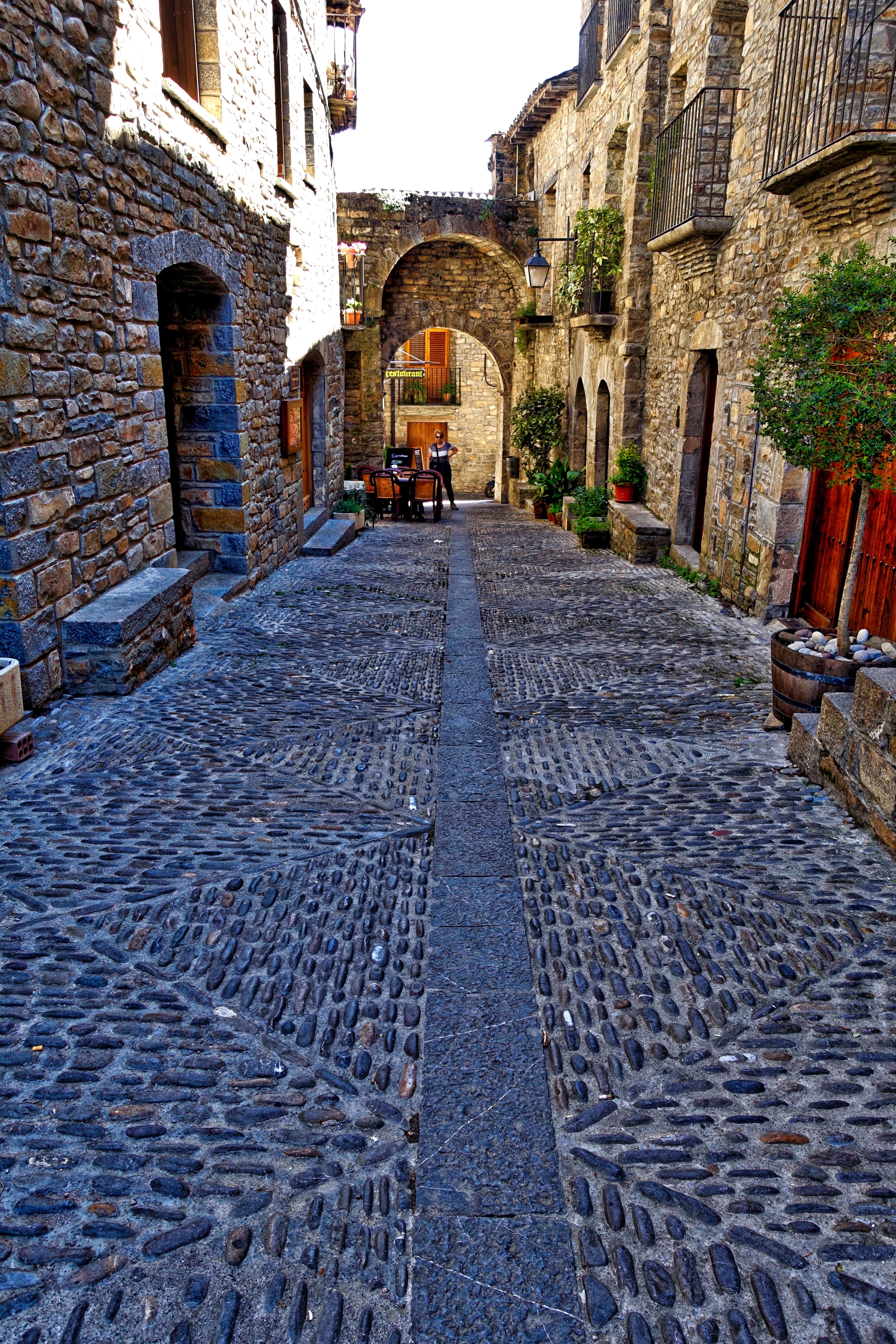 street, long, city, alley, building, cobbled, stones, built structure, surface level, rough, 5K, surface, arch, paving stone, direction, nature, paving, Phone HD Wallpaper