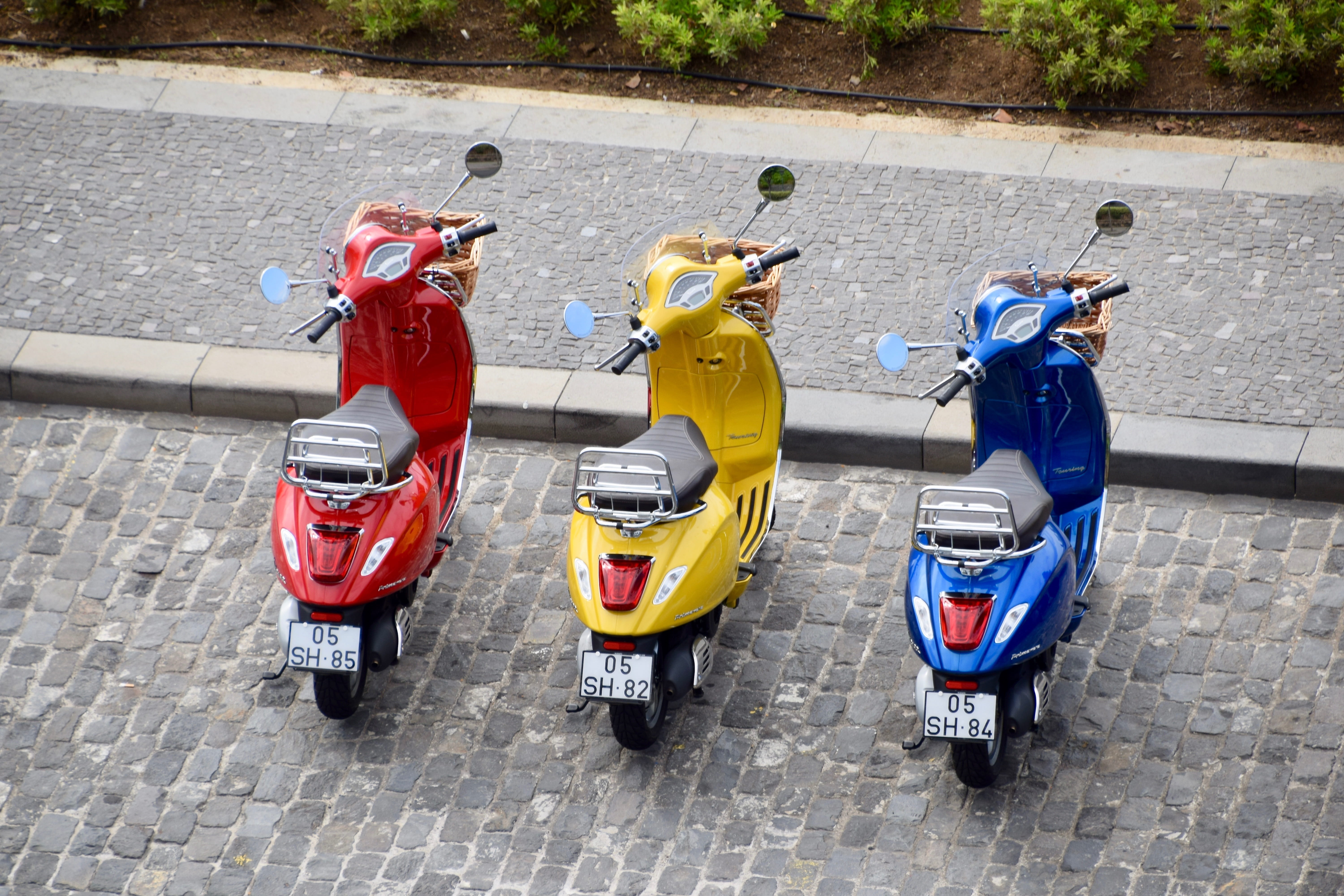 day, motorcycles, piaggio, security, transportation, pavement, wheels, land vehicle, men, mopeds, bikes, real people, stationary, outdoors, handle bars, HD Wallpaper