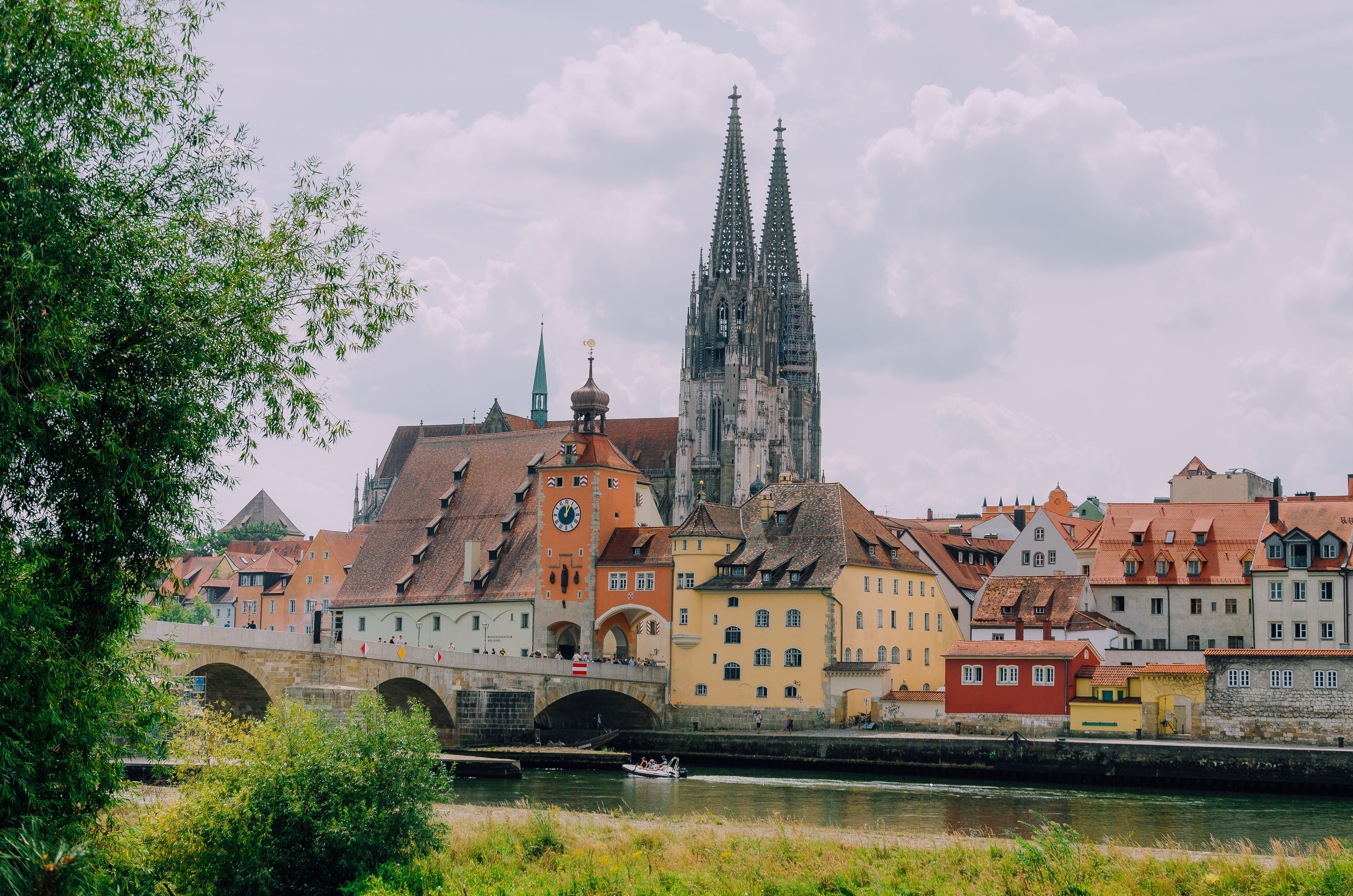 bavaria, stone bridge, religion, belief, water, clouds, city, architecture, tree, spirituality, tower, river, germany, landmark, houses, regensburg, regensburg cathedral, HD Wallpaper