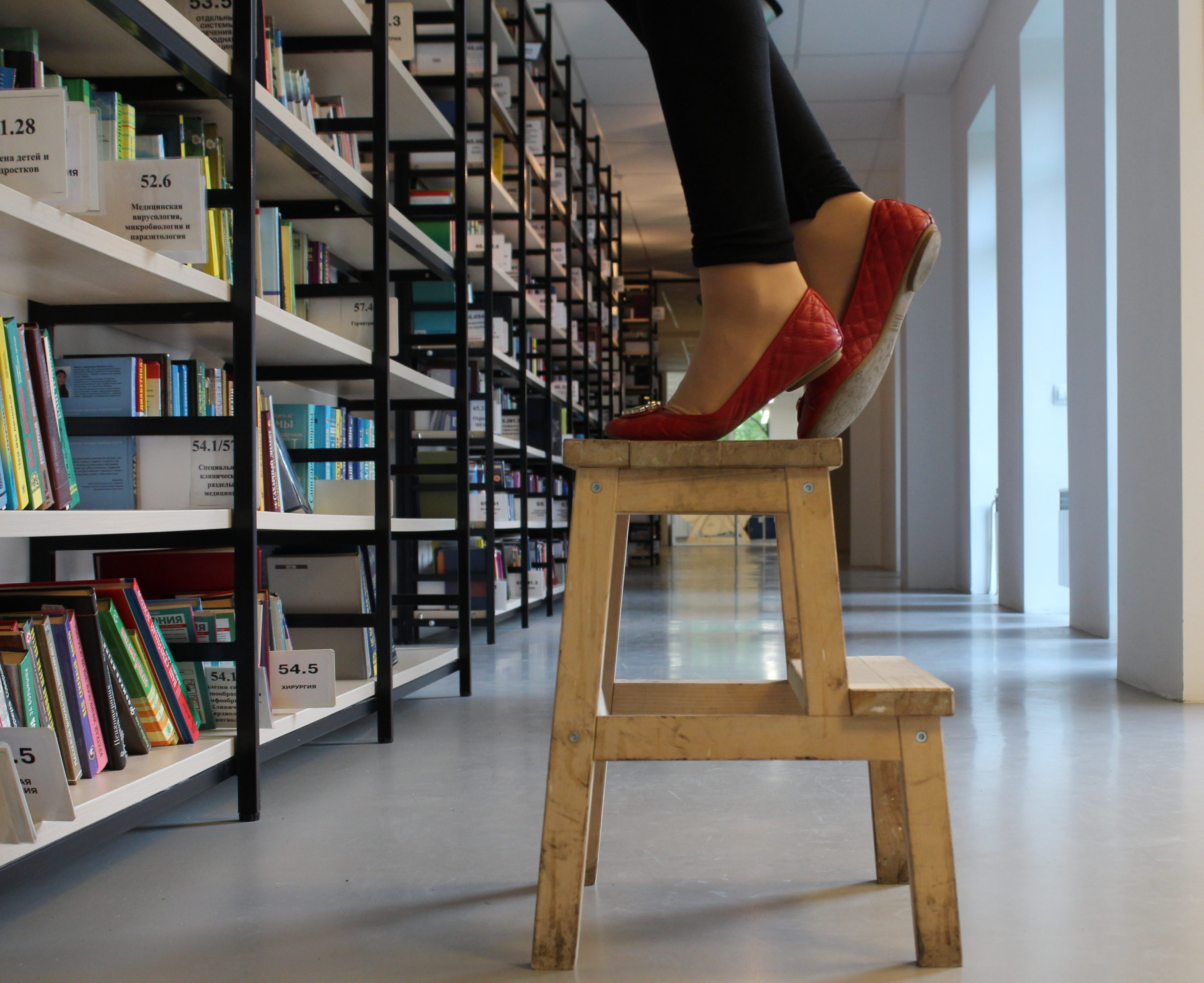 standing, home interior, publication, body part, human limb, stand, 4K, ladder, library, stool, flooring, shoes, indoors, real people, get, leisure activity, HD Wallpaper
