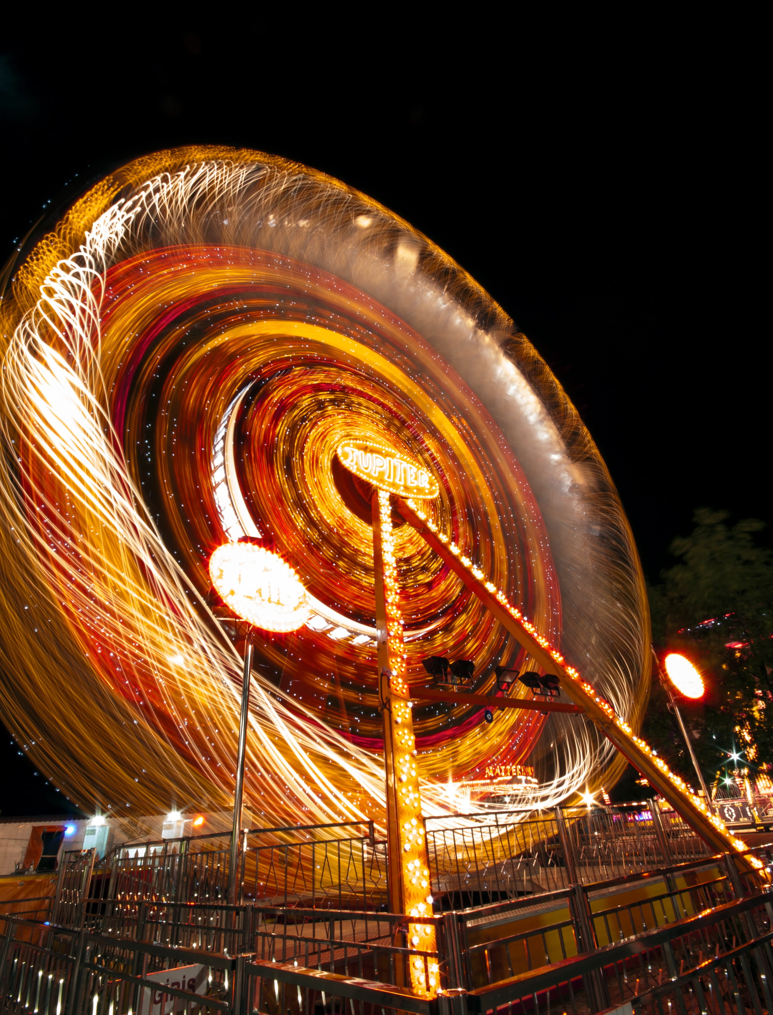 amusement park, fairground, circle, motion, carousel, light, 2K, entertainment, city, spinning, contemporary, design, long exposure, arts culture and entertainment, Phone HD Wallpaper