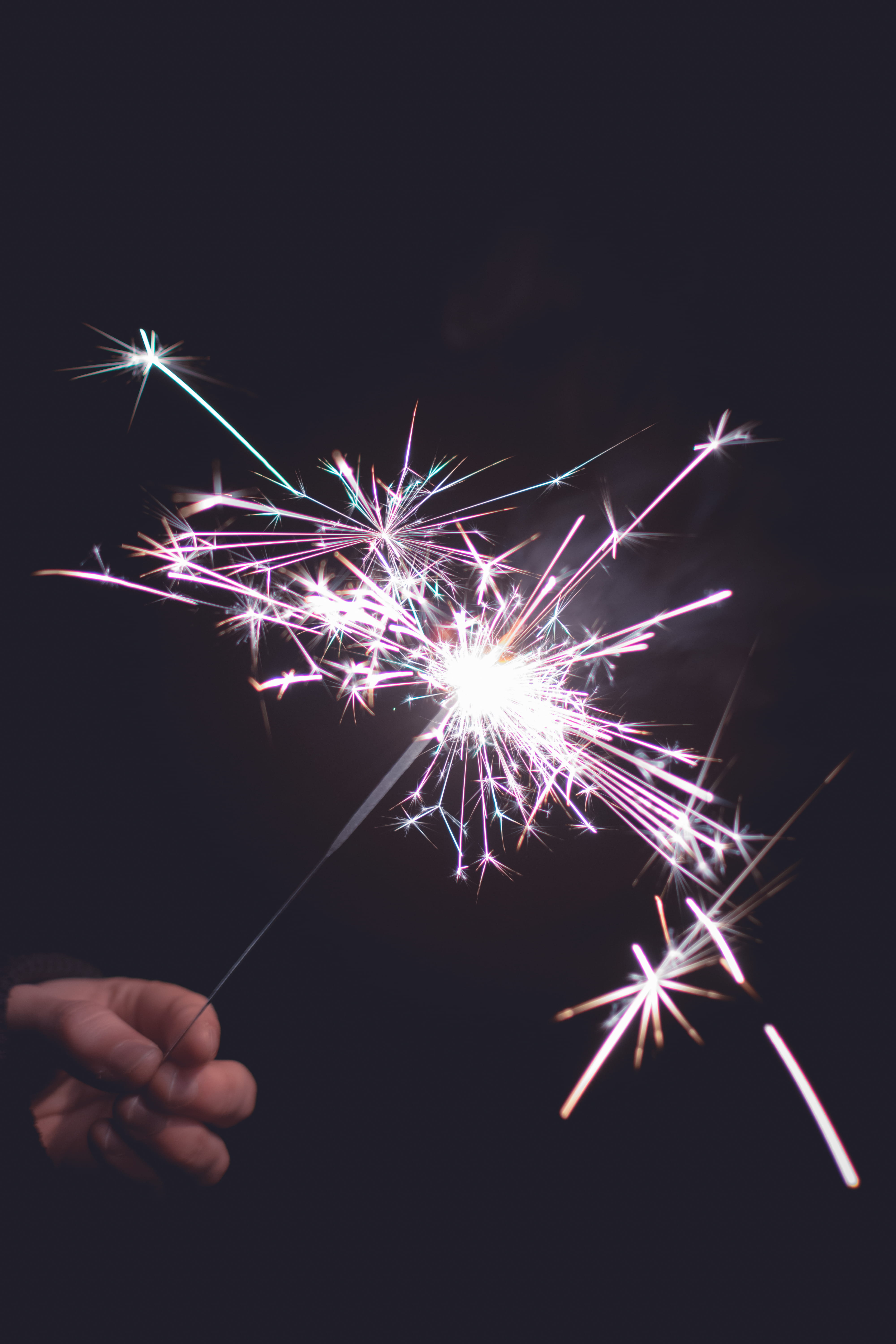 burning, sparkle, 5K, year, light, one person, illuminated, firework - man made object, sparkler, black background, arts culture and entertainment, fire, Phone HD Wallpaper