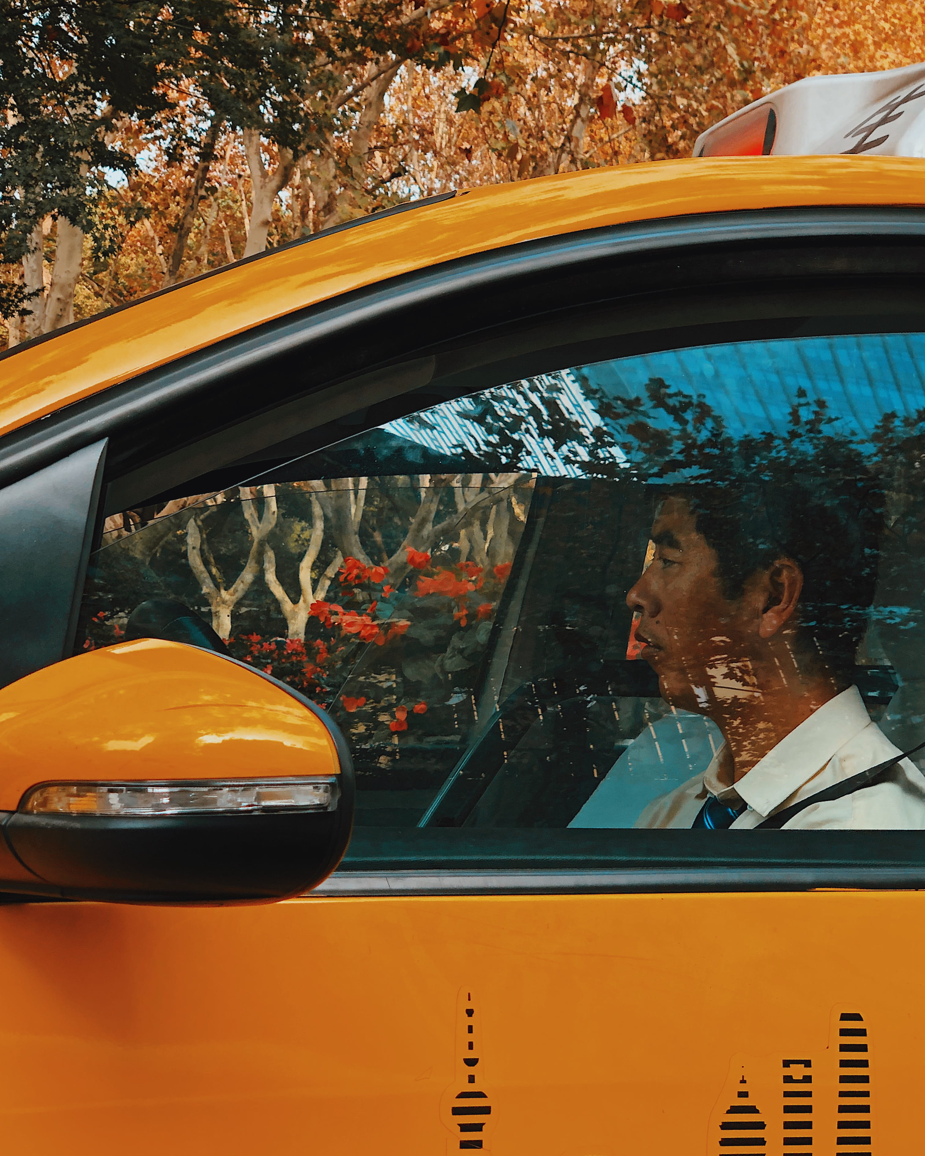 outdoors, orange color, human, 2K, tire, reflection, vehicle interior, man, men, light, land vehicle, looking, transportation, mature men, car, spoke, Phone HD Wallpaper