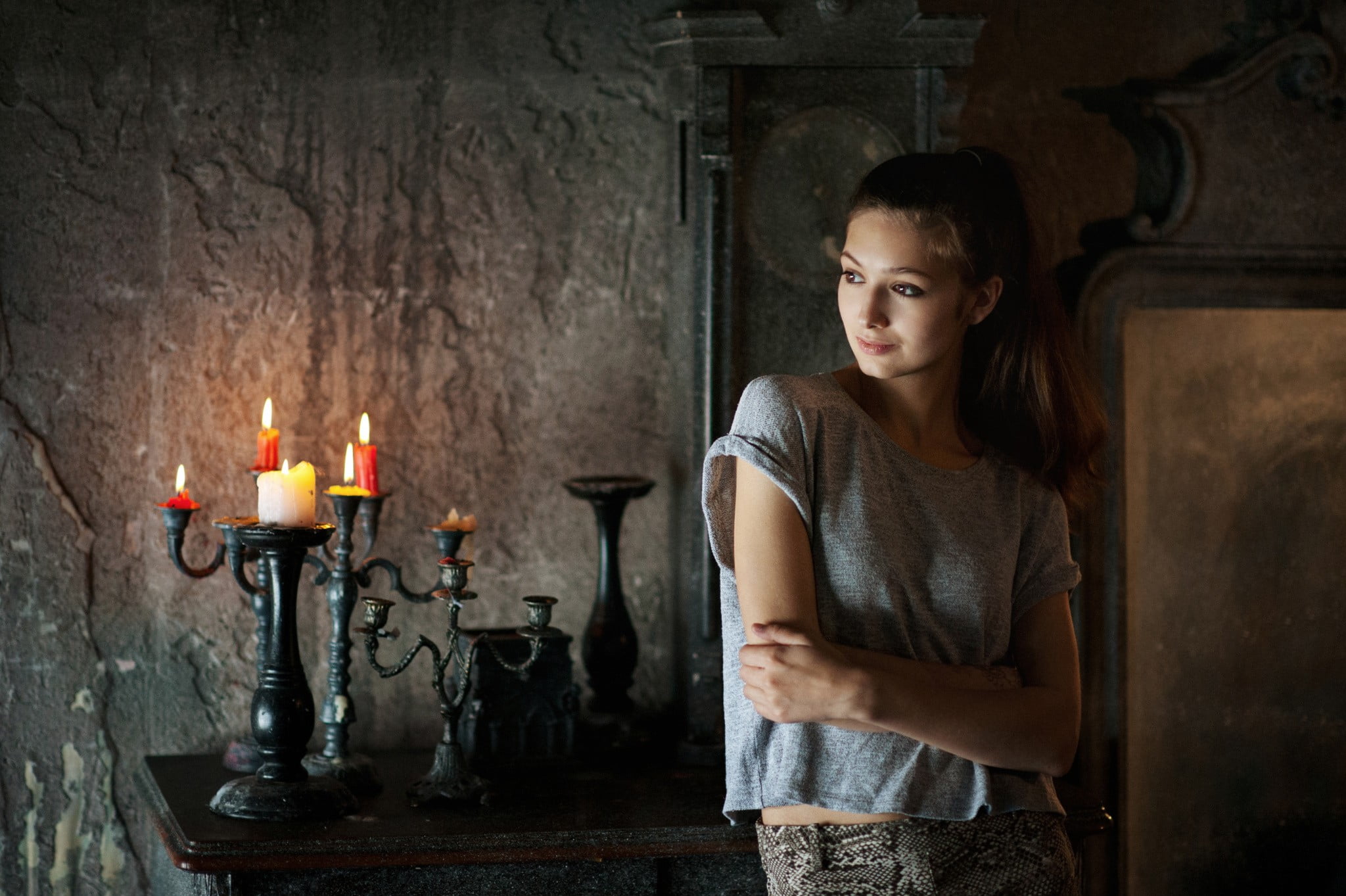 antique, contemplation, brown hair, looking, beautiful woman, serious, hairstyle, sadness, 1080P, fire, interior, candle, T-shirt, candles, indoors, front view, HD Wallpaper