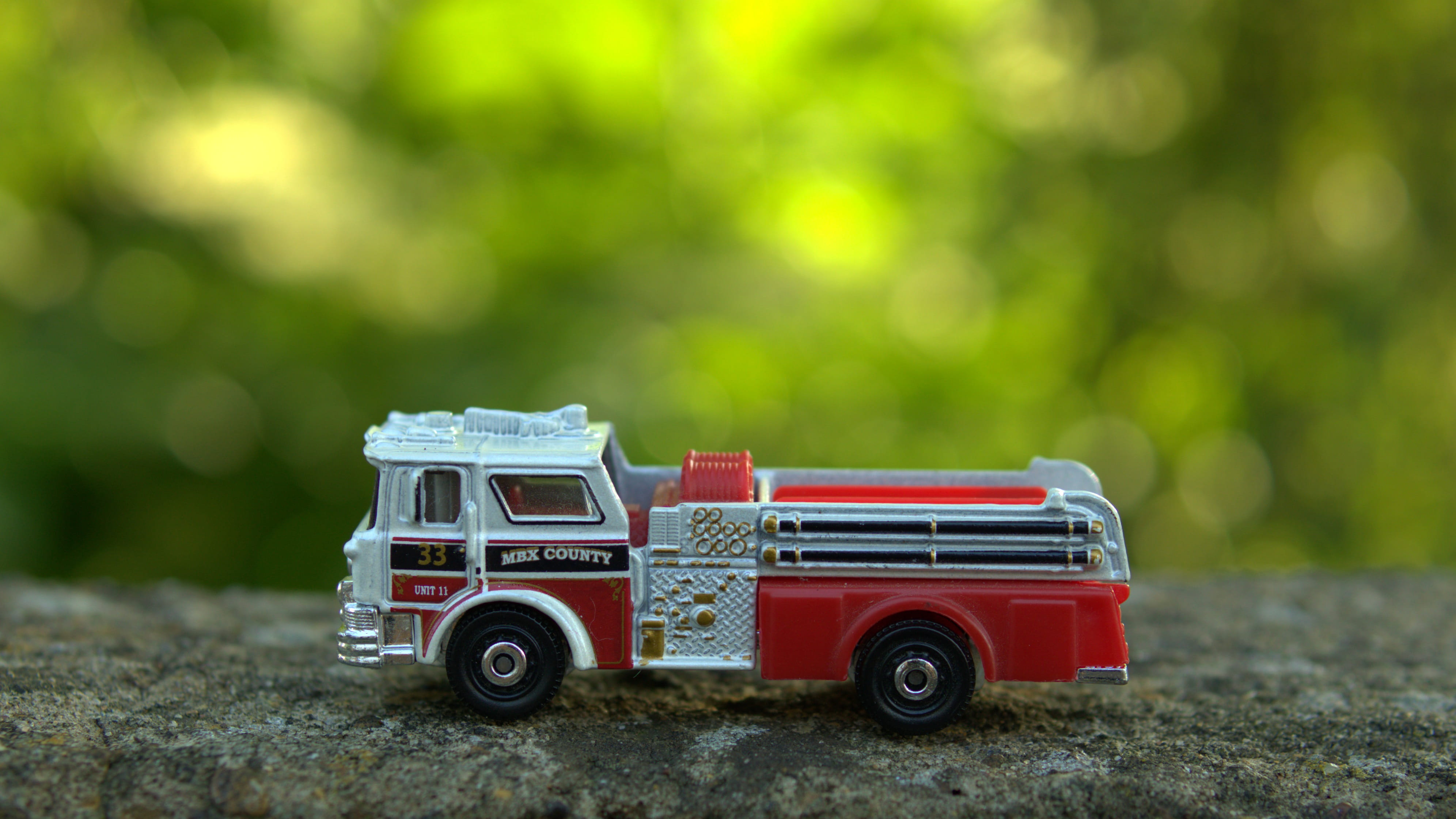 close-up, transportation, nature, mode of transportation, toy car, toy, fire truck, outdoors, 4K, grass, motor vehicle, plant, no people, car, focus on foreground, HD Wallpaper