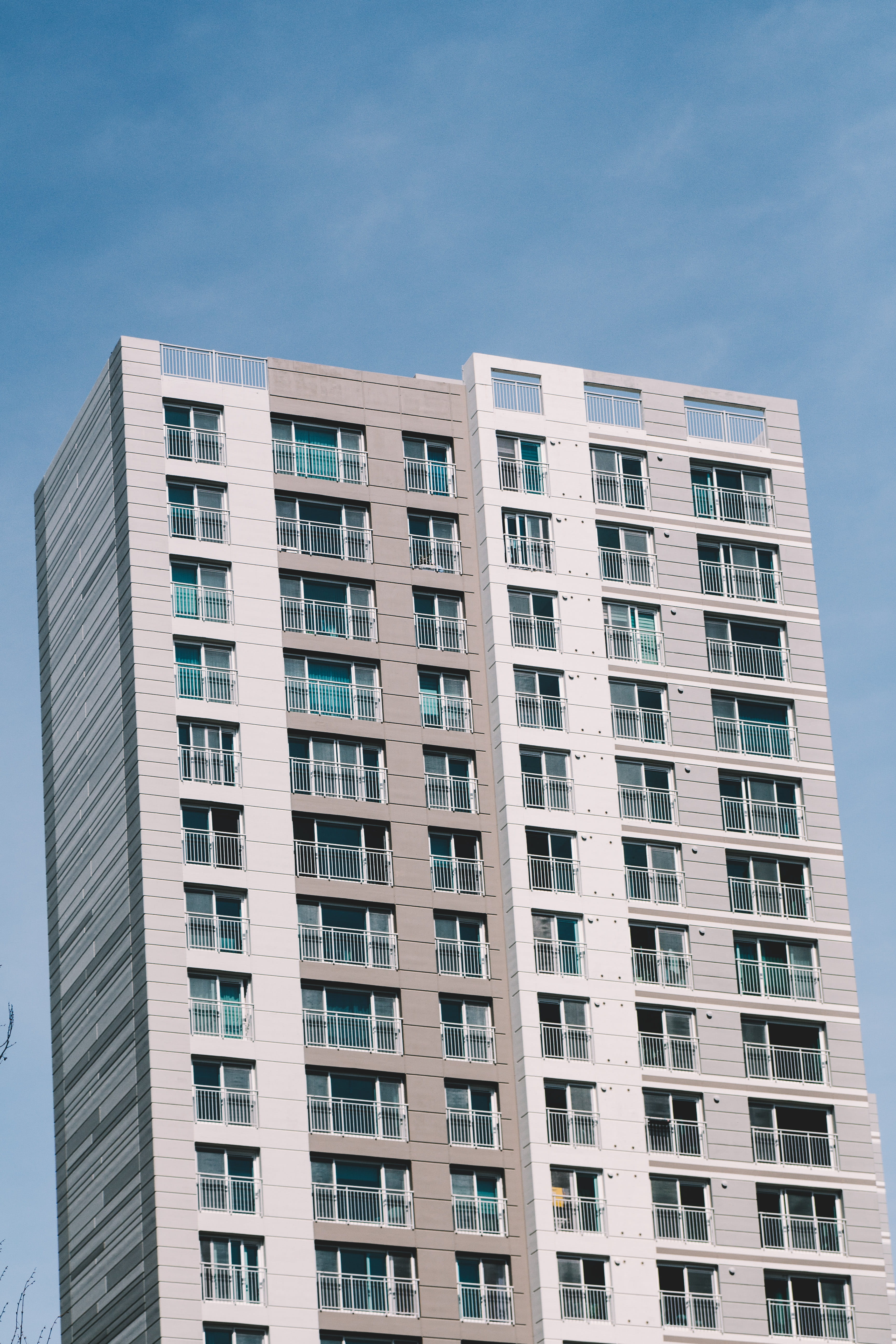 town, building, day, in a row, room, apartment building, window, awning, sky, high, no people, rise, clear sky, blue, outdoors, canopy, city, low angle view, Phone HD Wallpaper