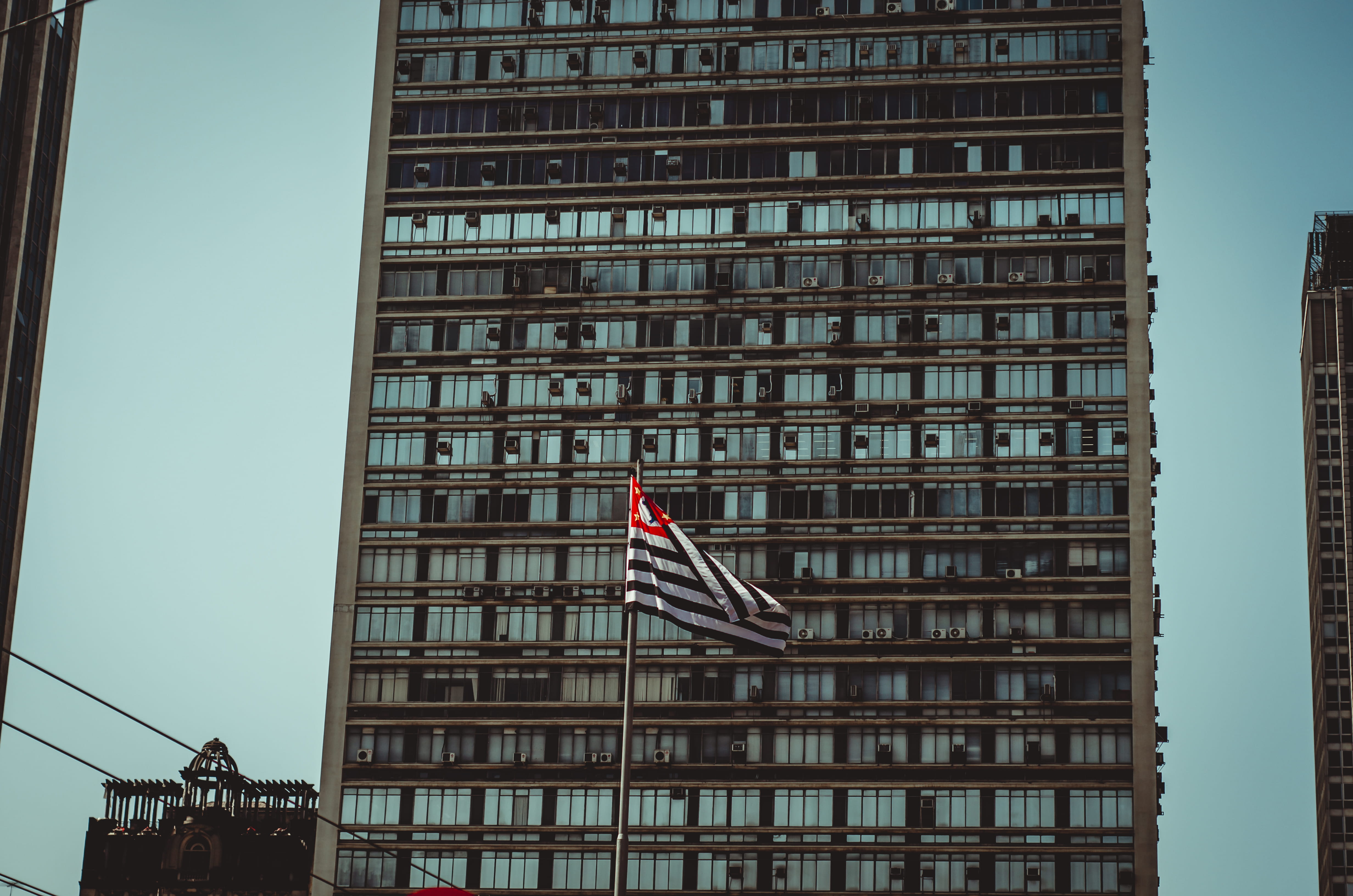 architectural design, flag, striped, patriotism, low angle shot, downtown, window, construction, outdoors, office, exterior, skyscraper, perspective, no people, HD Wallpaper