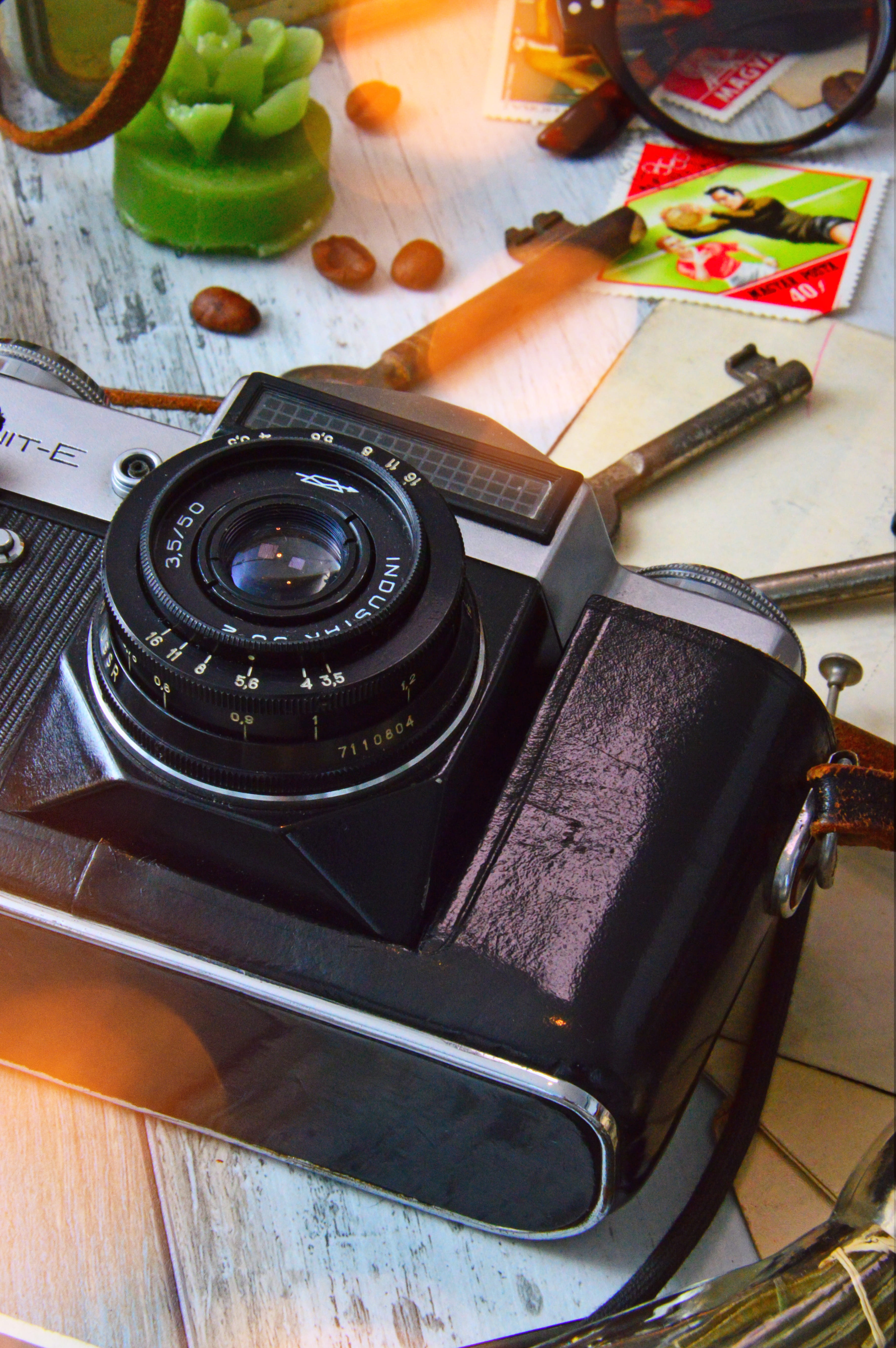 camera, paper, stamps, skeleton, high angle view, black, close-up, wellbeing, healthy eating, no people, indoors, publication, photography themes, cutting board, Phone HD Wallpaper