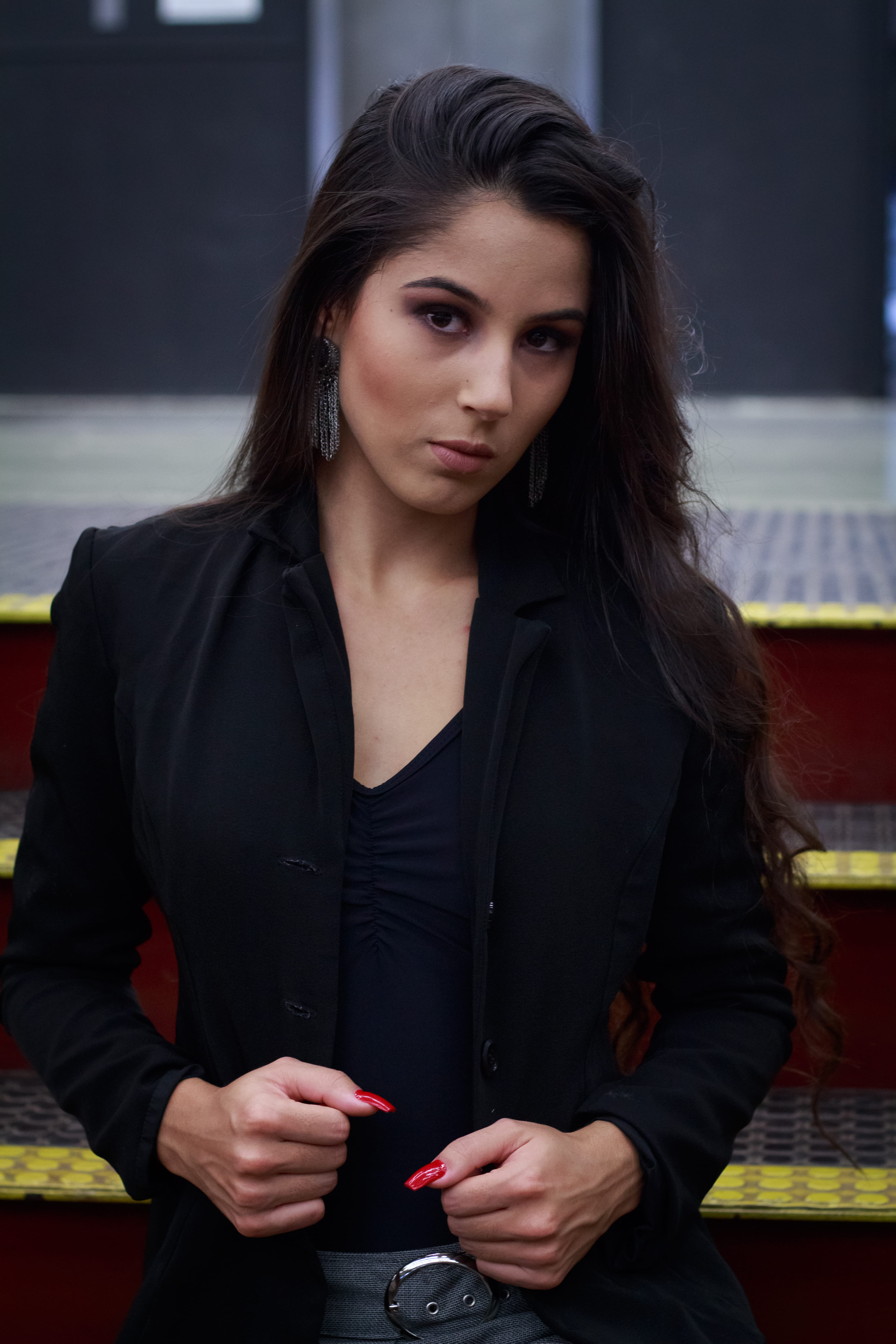 hair, powerful, fearless, young adult, looking at camera, 5K, adult, person, women, wireless technology, young women, finger, front view, jacket, couch, Phone HD Wallpaper