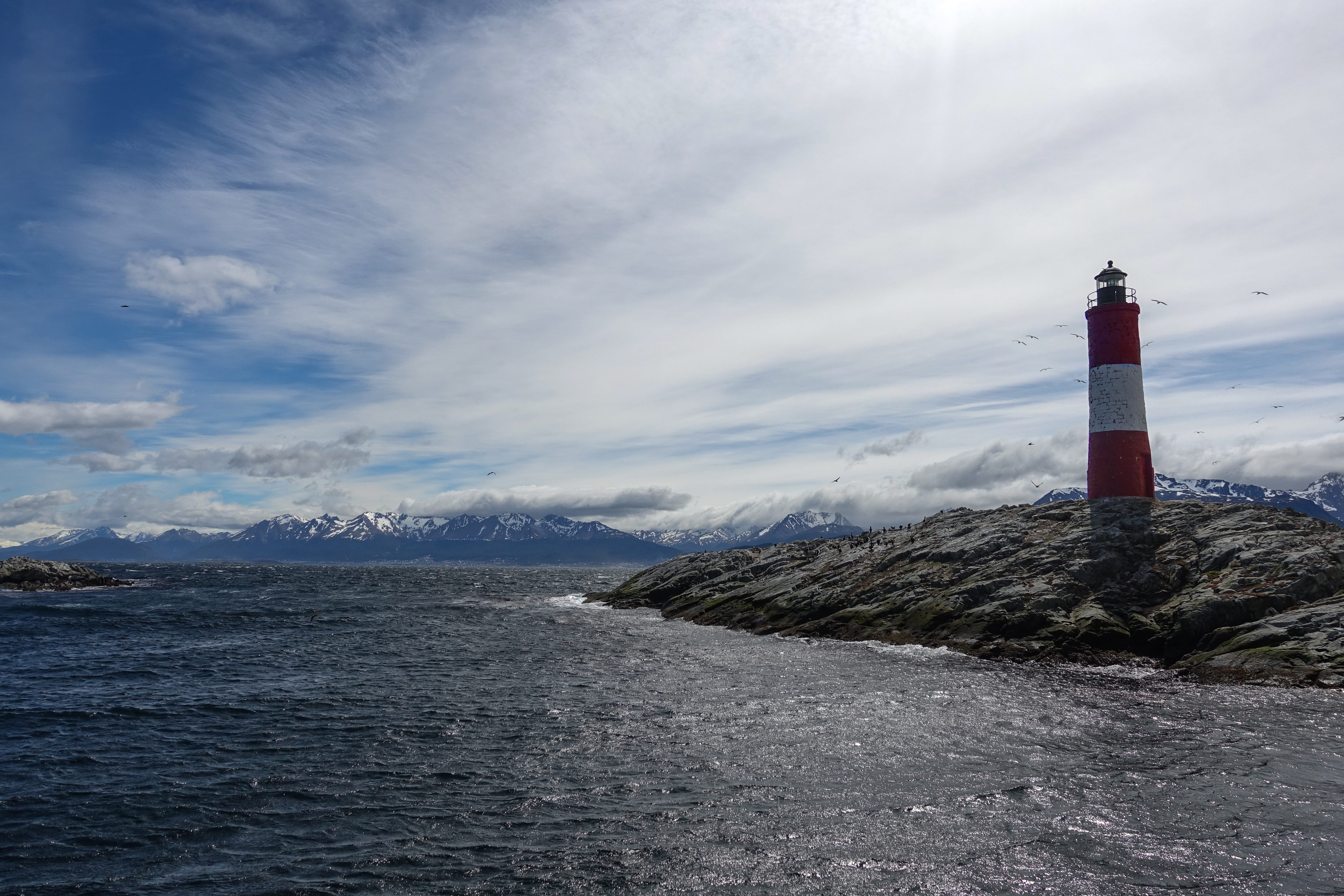 building, water, scenics - nature, protection, direction, near, coast, landscape, red, rugged, shoreline, mountain, safety, sea, outdoors, cloud, built structure, HD Wallpaper