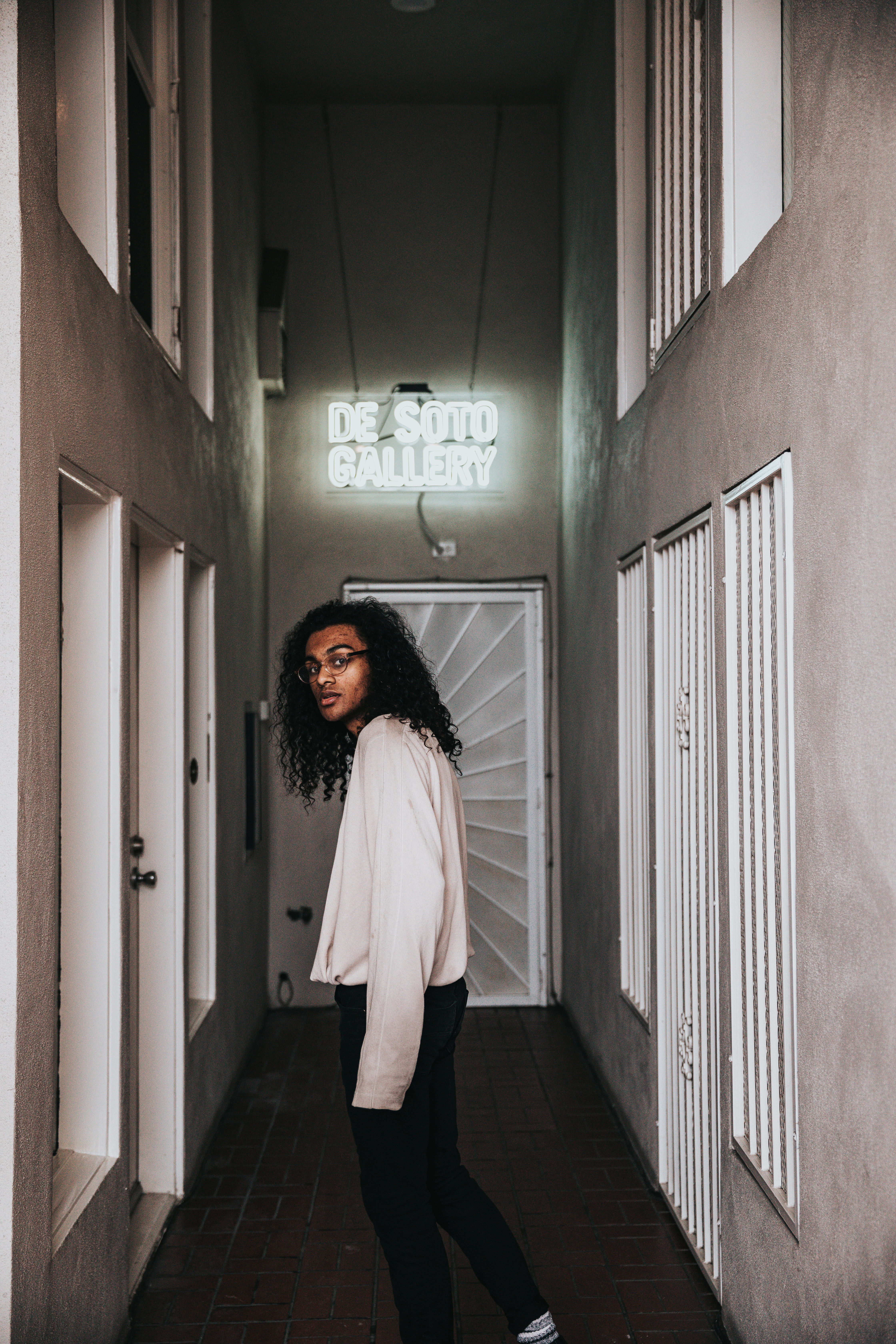 urban, walking, standing, curly hair, door, street wear, venice, man, male, 5K, portrait, hairstyle, neon sign, women, wall - building feature, real people, Phone HD Wallpaper
