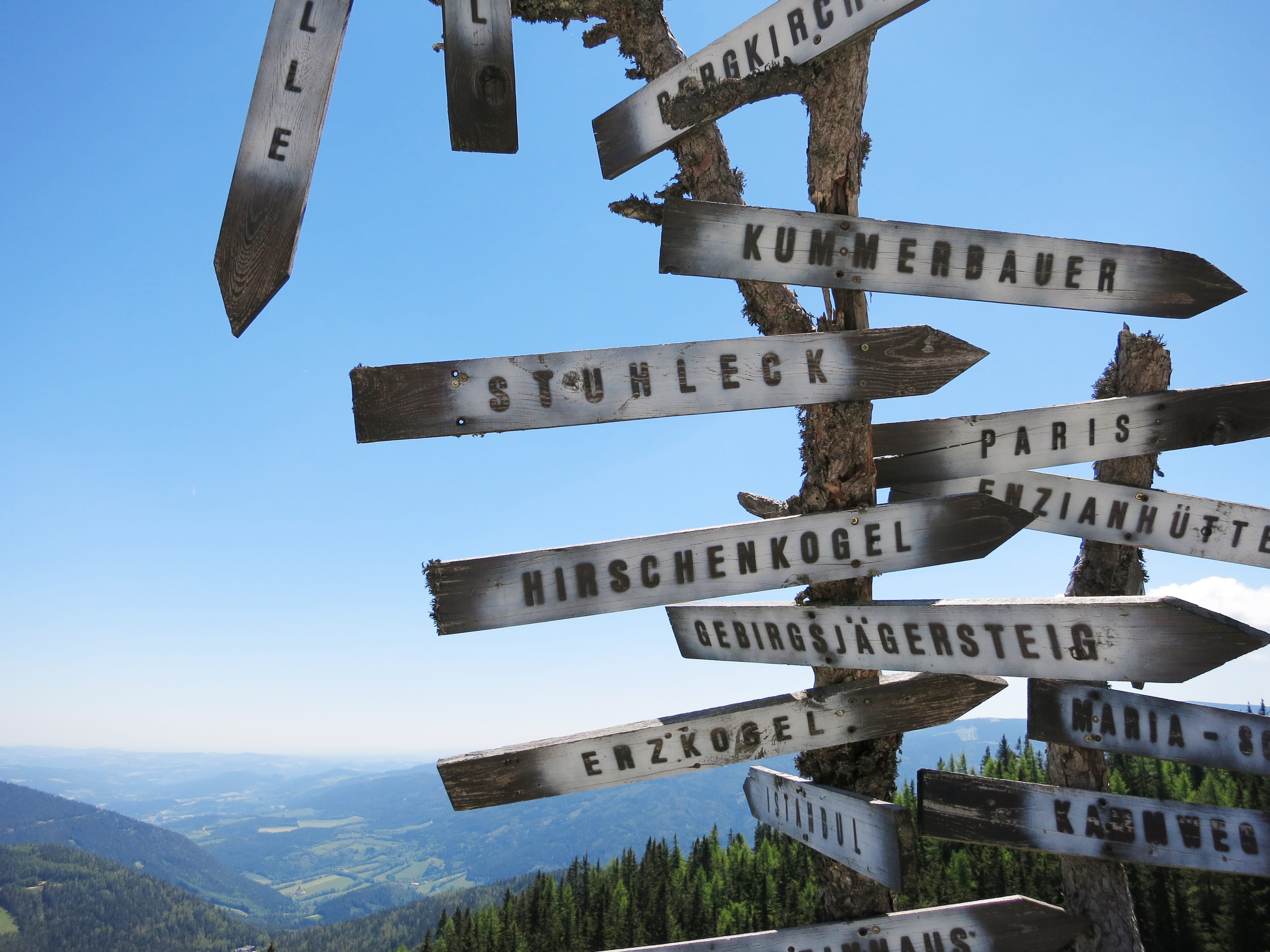 sunlight, built structure, guidance, next, marking, city, person, signpost, architecture, sky, mountain, low angle view, showing, arrow, clear sky, outdoors, HD Wallpaper