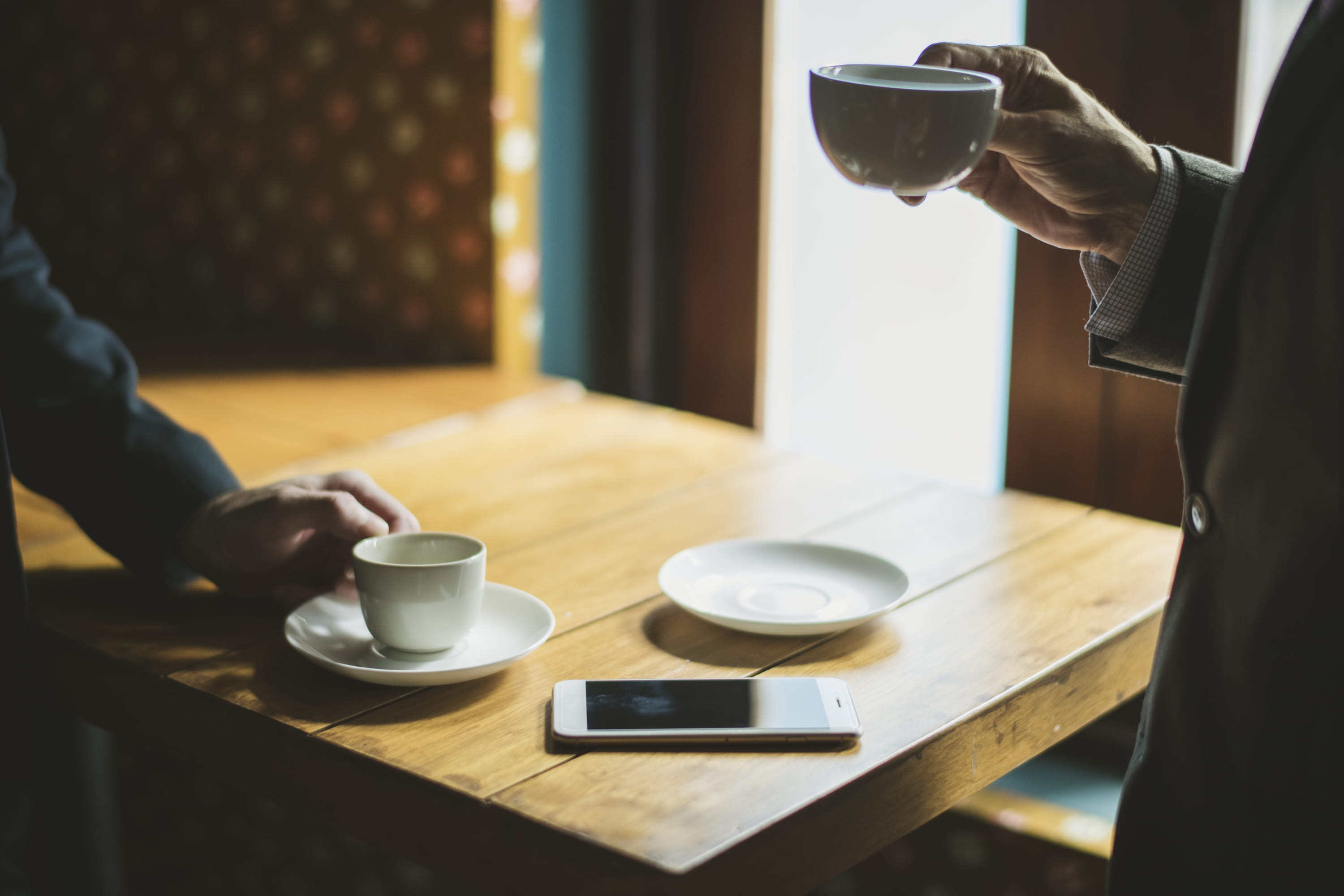 one person, refreshment, drinking, food and drink, drink, wood, wooden table, human body part, holding, saucer, hand, human hand, formal, cup, indoors, HD Wallpaper