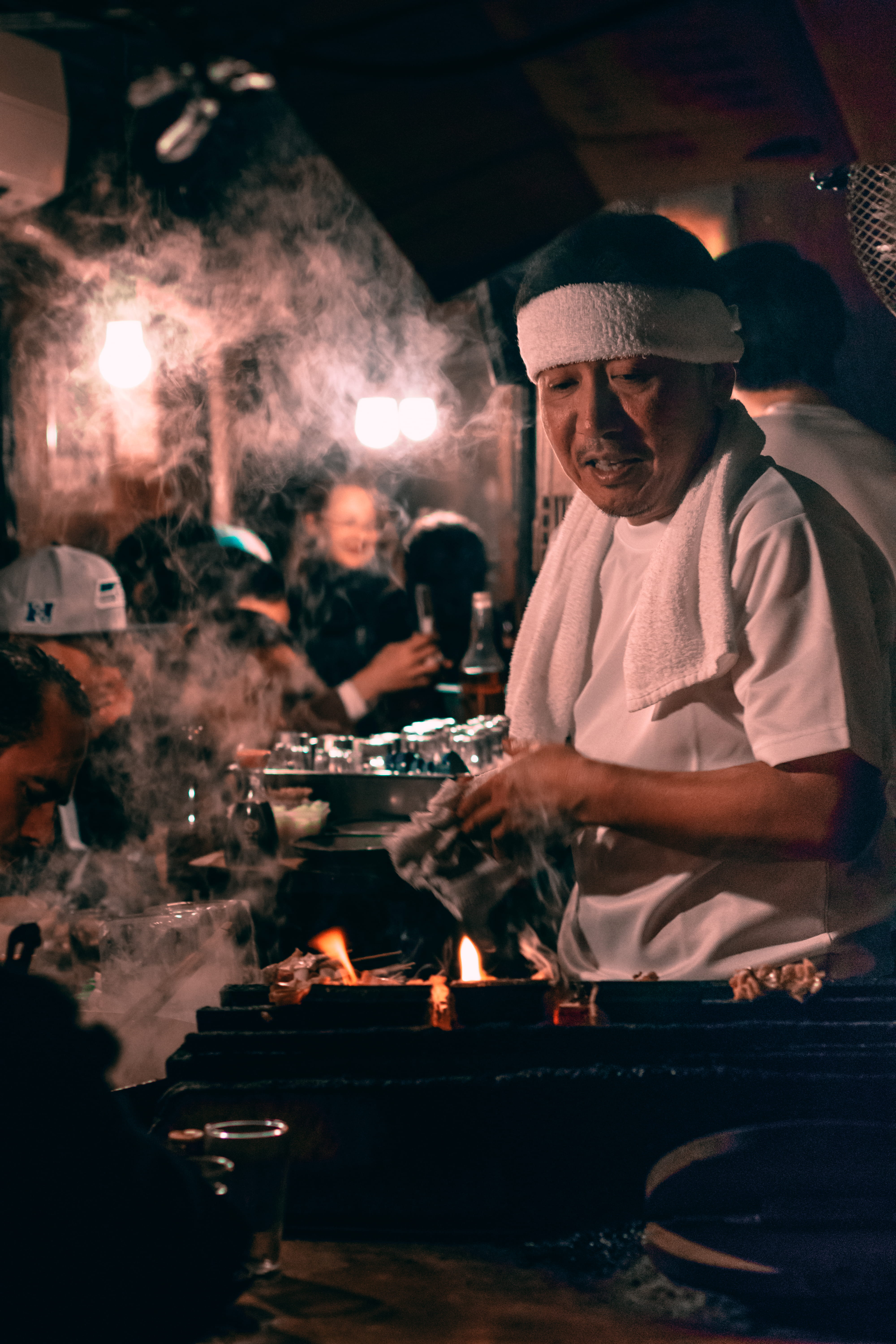adult, towel, flame, night life, men, food and drink, real people, tray, occupation, young men, man, smoke, headband, group of people, nightclub, white, Phone HD Wallpaper