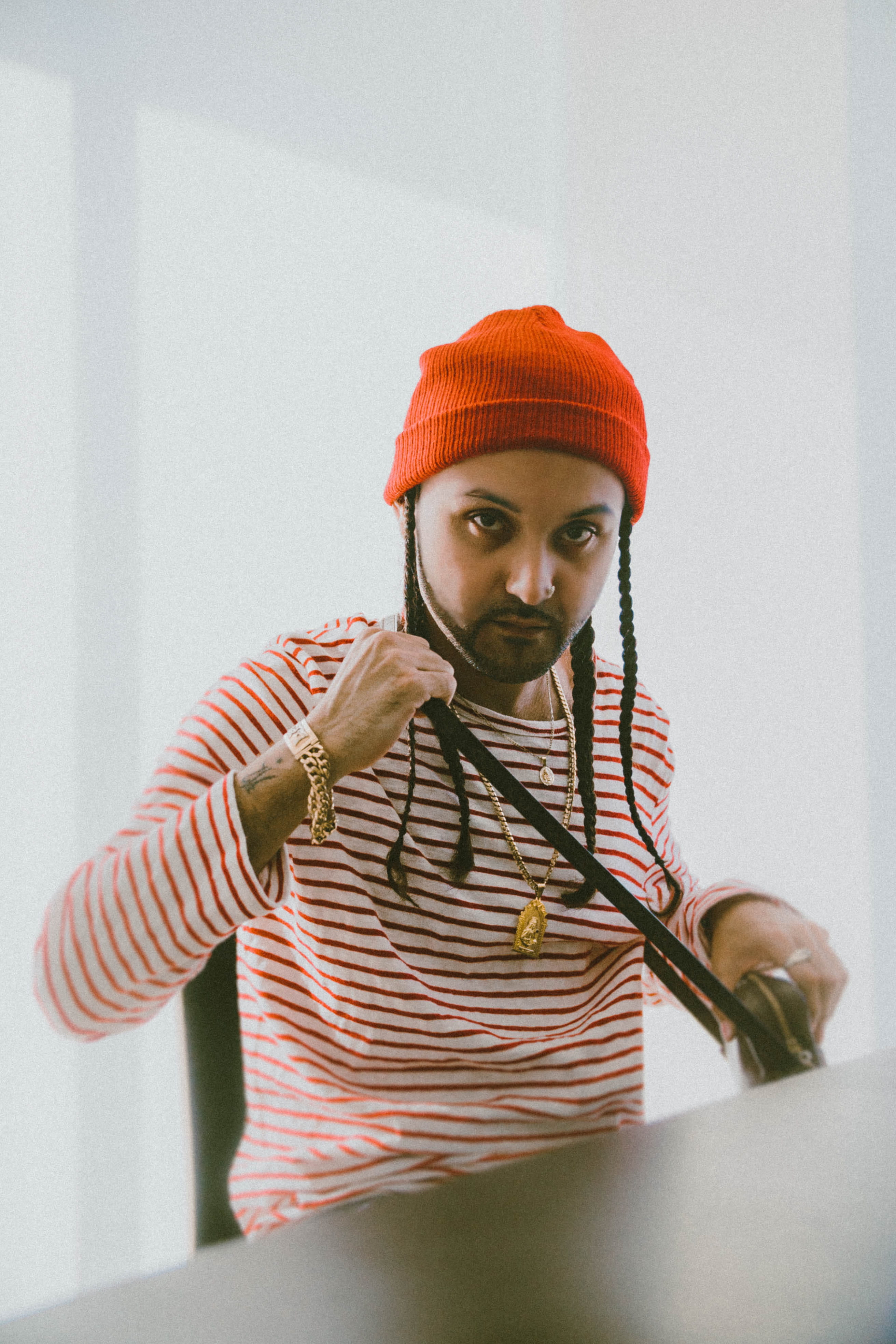 man, indoors, red, person, young adult, bed, apparel, bathing cap, wearing, one person, bonnet, warm clothing, real people, waist up, clothing, hat, striped, Phone HD Wallpaper