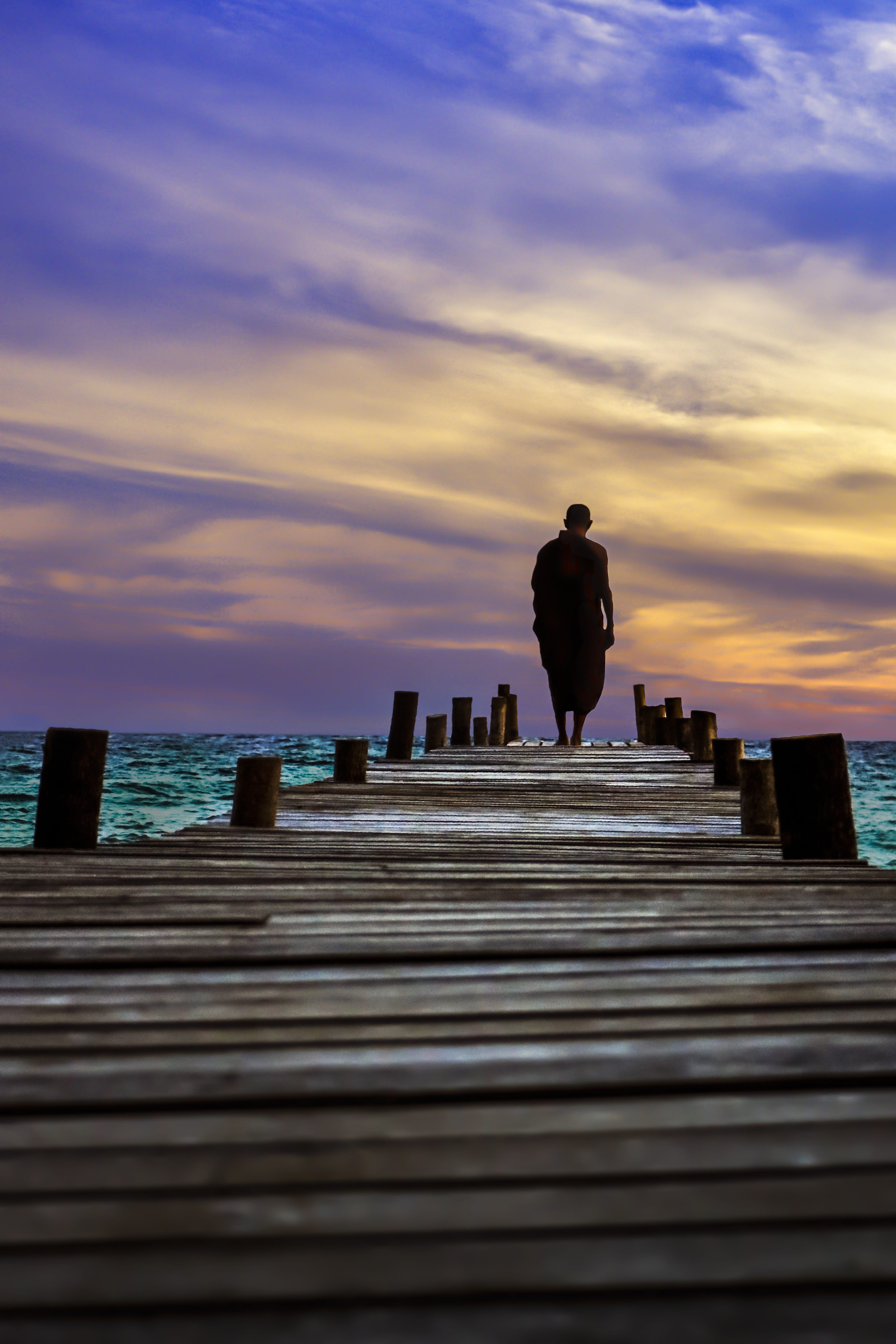 buddhism, man, travel, dawn, standing, water, lang tengah island, full length, daytime, architecture, lifestyles, twilight, wooden, rear view, leisure activity, Phone HD Wallpaper