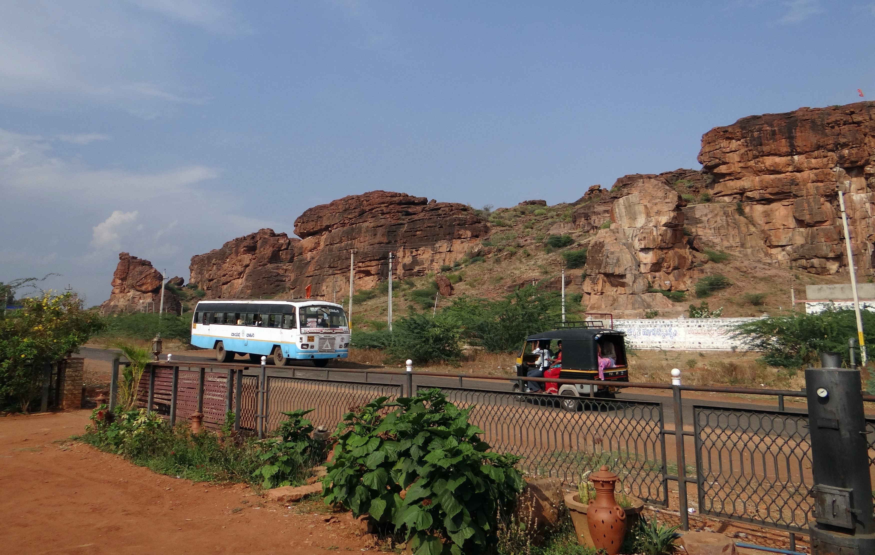 badami, nature, railing, sky, incidental people, bus, formation, outdoors, land vehicle, day, sand stone, red, desert, plant, architecture, rocks, motor vehicle, HD Wallpaper